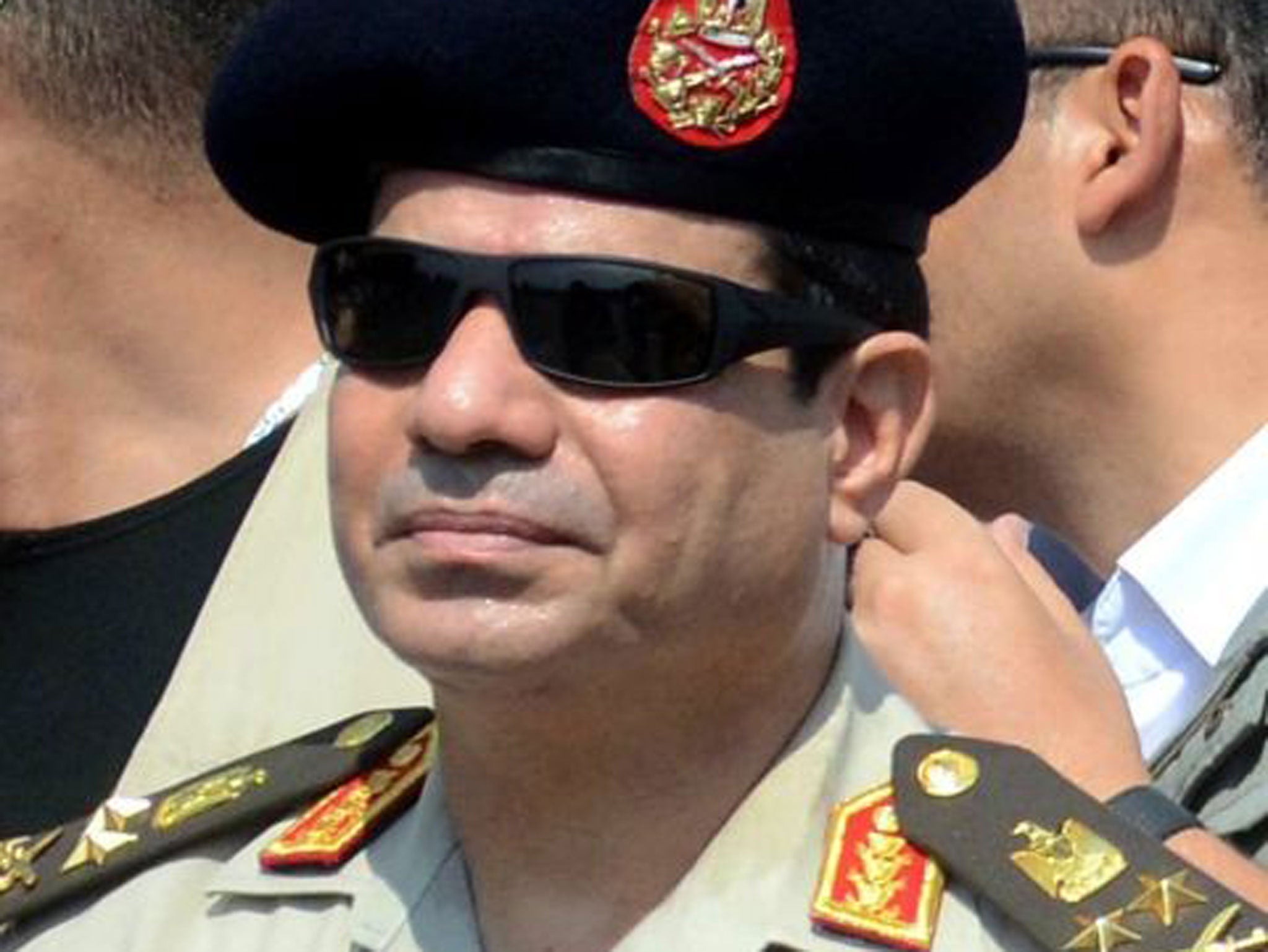 Abdel Fattah al-Sisi attending the funeral of Giza security chief Nabil Farrag in 2013