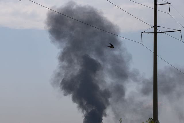 Black smoke rises from a shot down Ukrainian Army helicopter outside Slovyansk