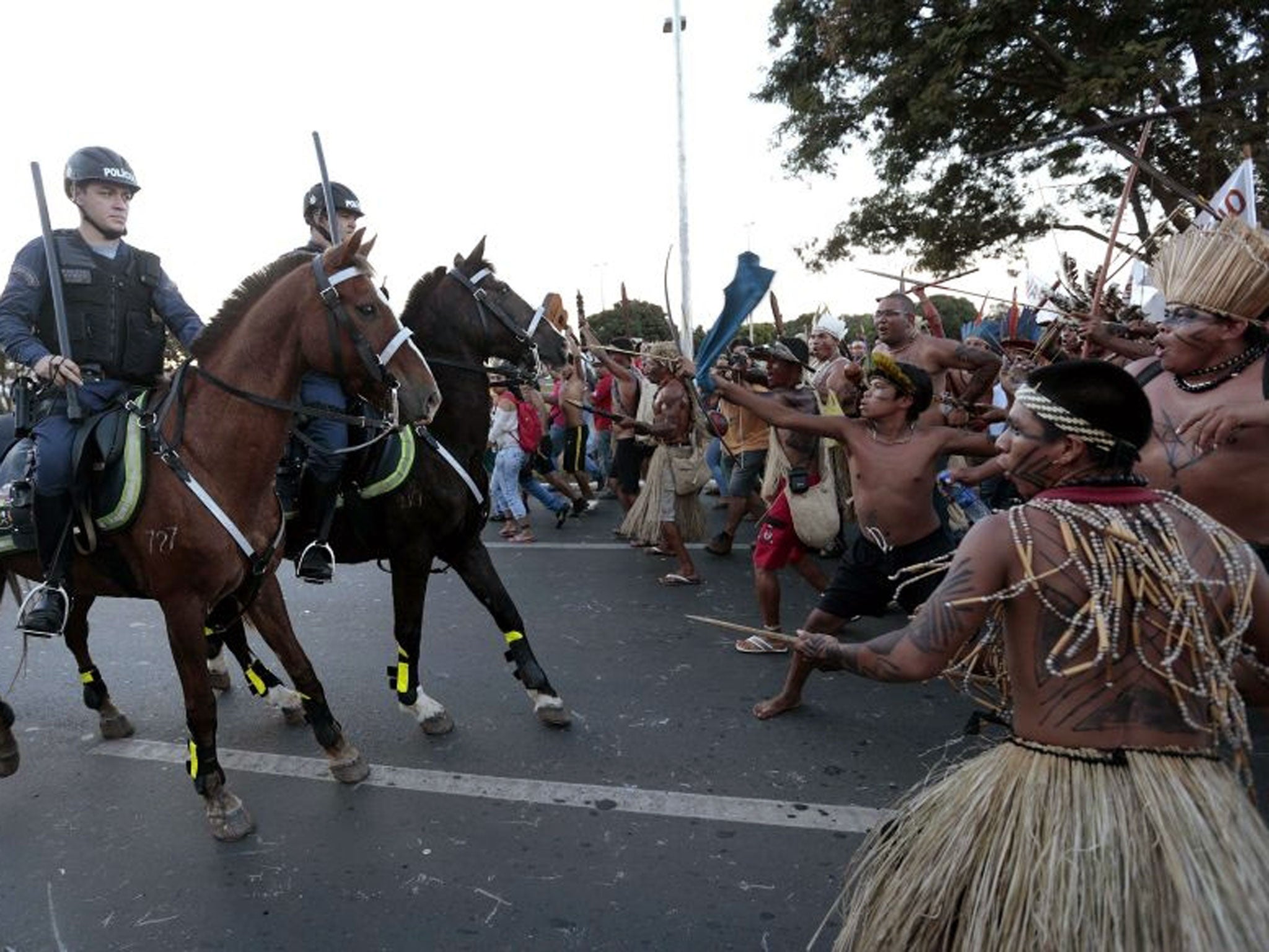 Police confront native Brazilians to prevent them from marching towards the Mane Garrincha soccer stadium during a demonstration in Brasilia May 27, 2014.