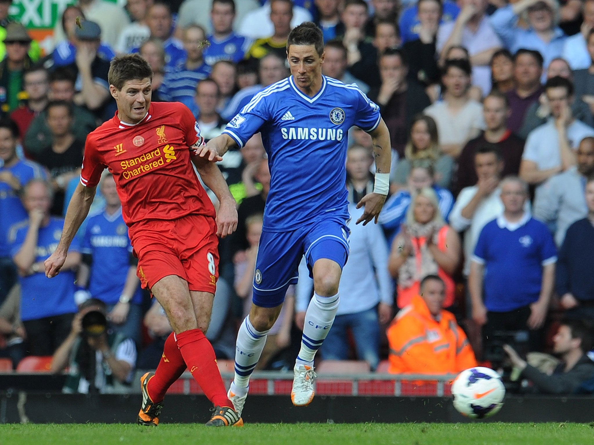 Steven Gerrard and Fernando Torres compete for the ball during a meeting between Liverpool and Chelsea in April 2014