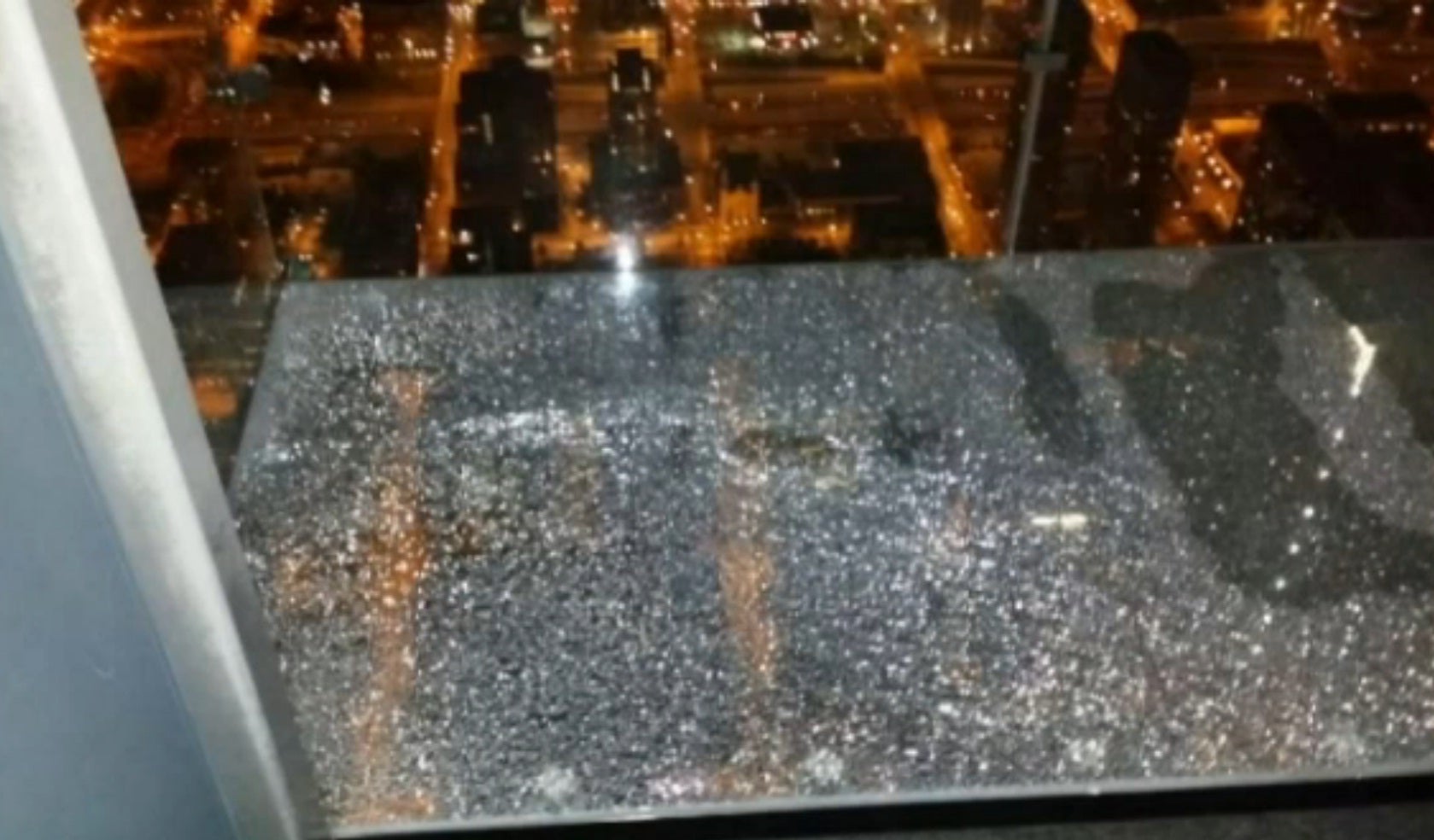 A visitor to the tower took a photo of the glass beneath them