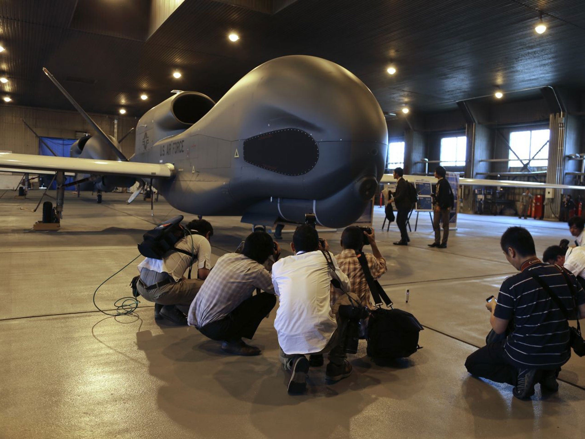 Japanese journalists on the arrival of a Global Hawk