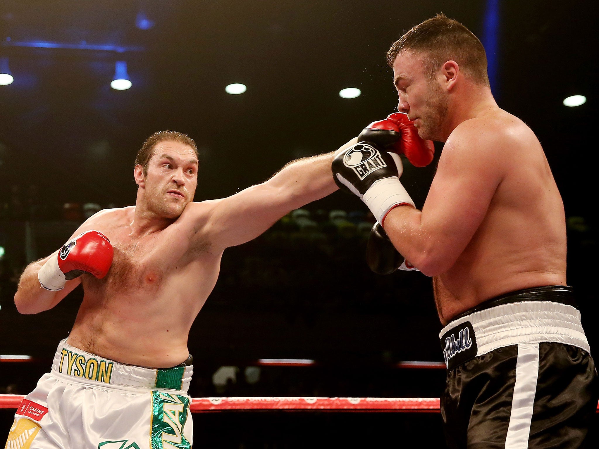 Tyson Fury of Great Britain in action with Joey Abell of USA during their International Heavyweight bout at The Copper Box on February 15, 2014 in London, England.