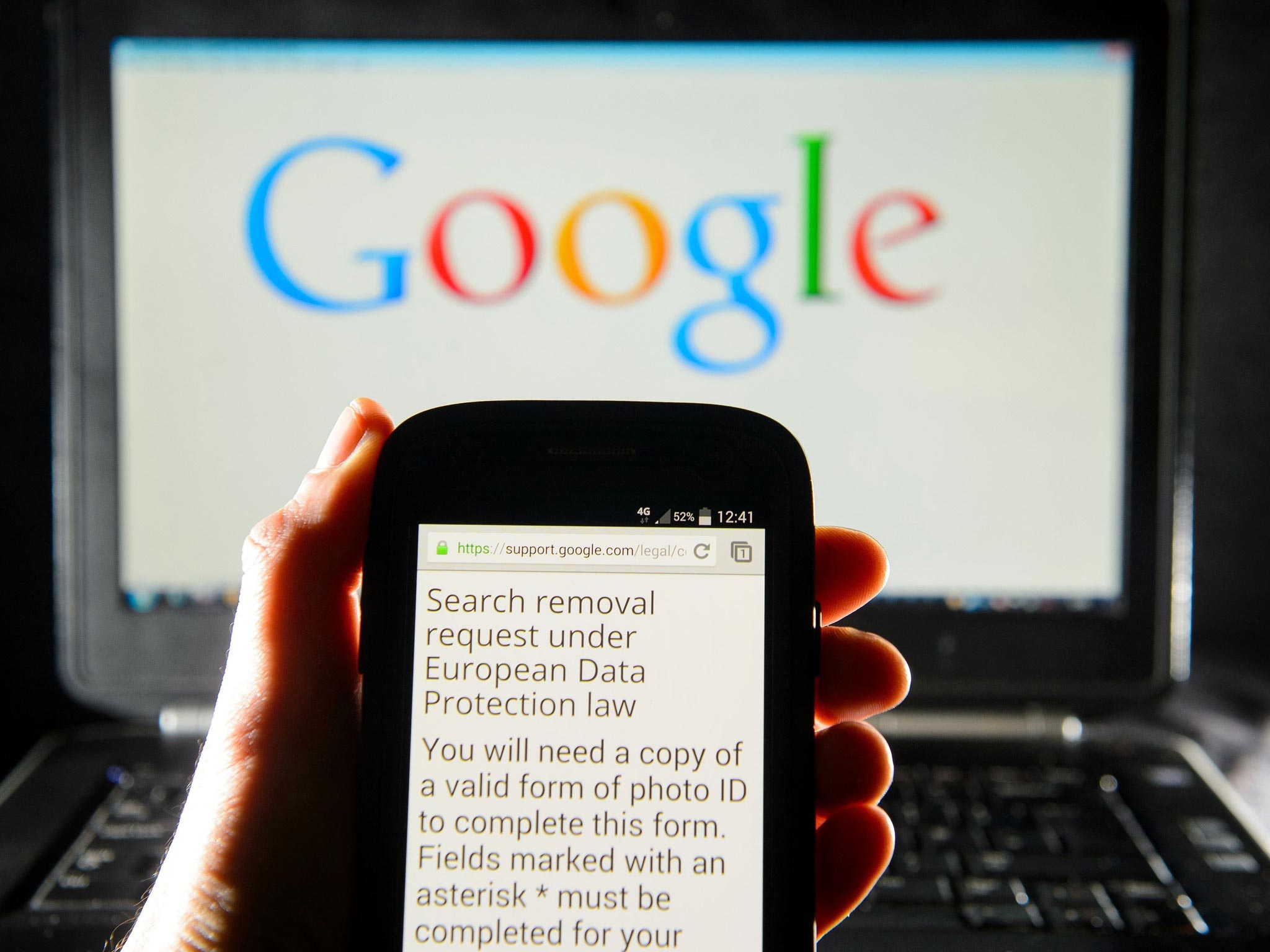 A Google search removal request on the screen of a
smartphone