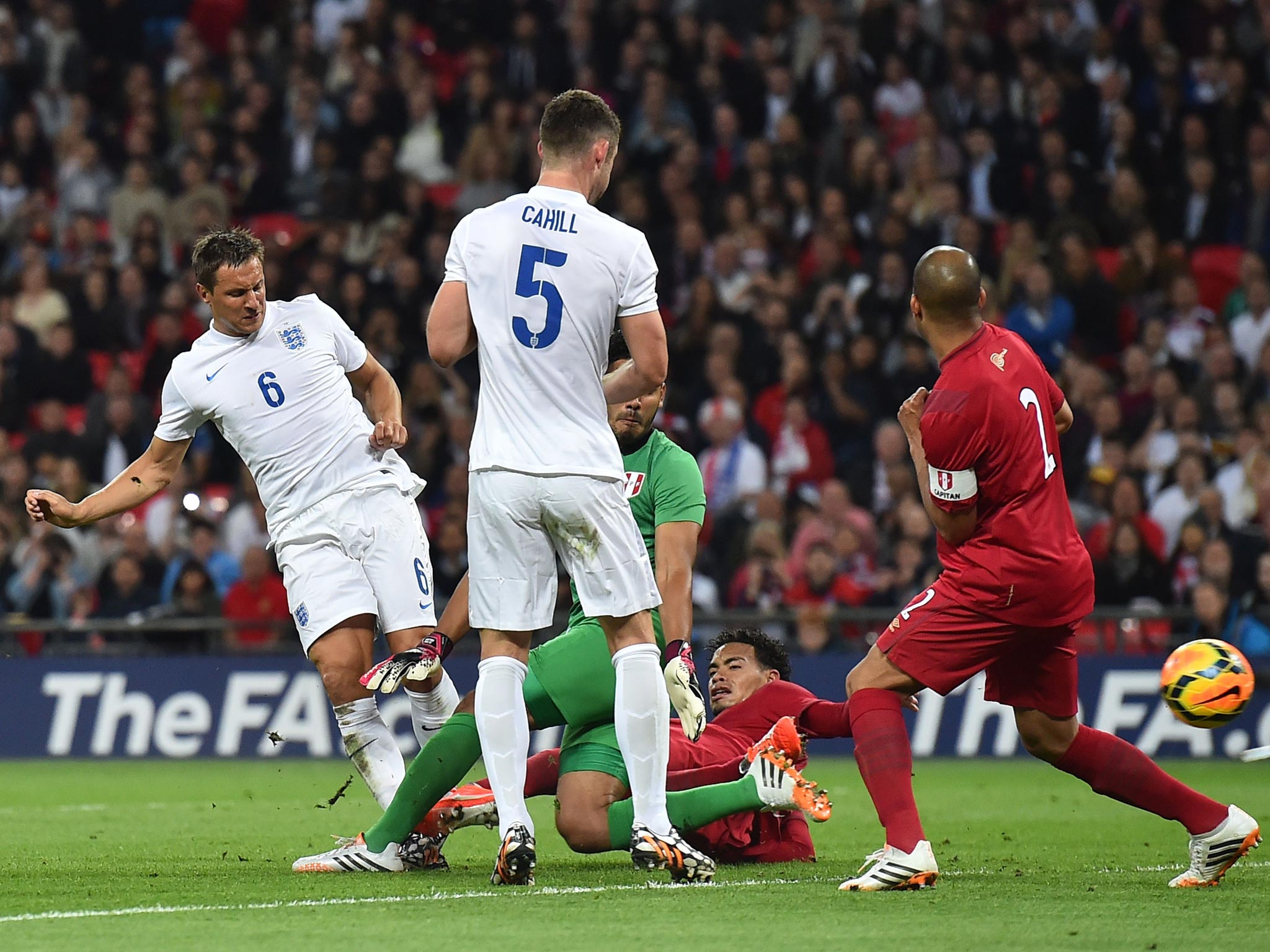 Phil Jagielka scores England’s third goal after an error by the Peru goalkeeper