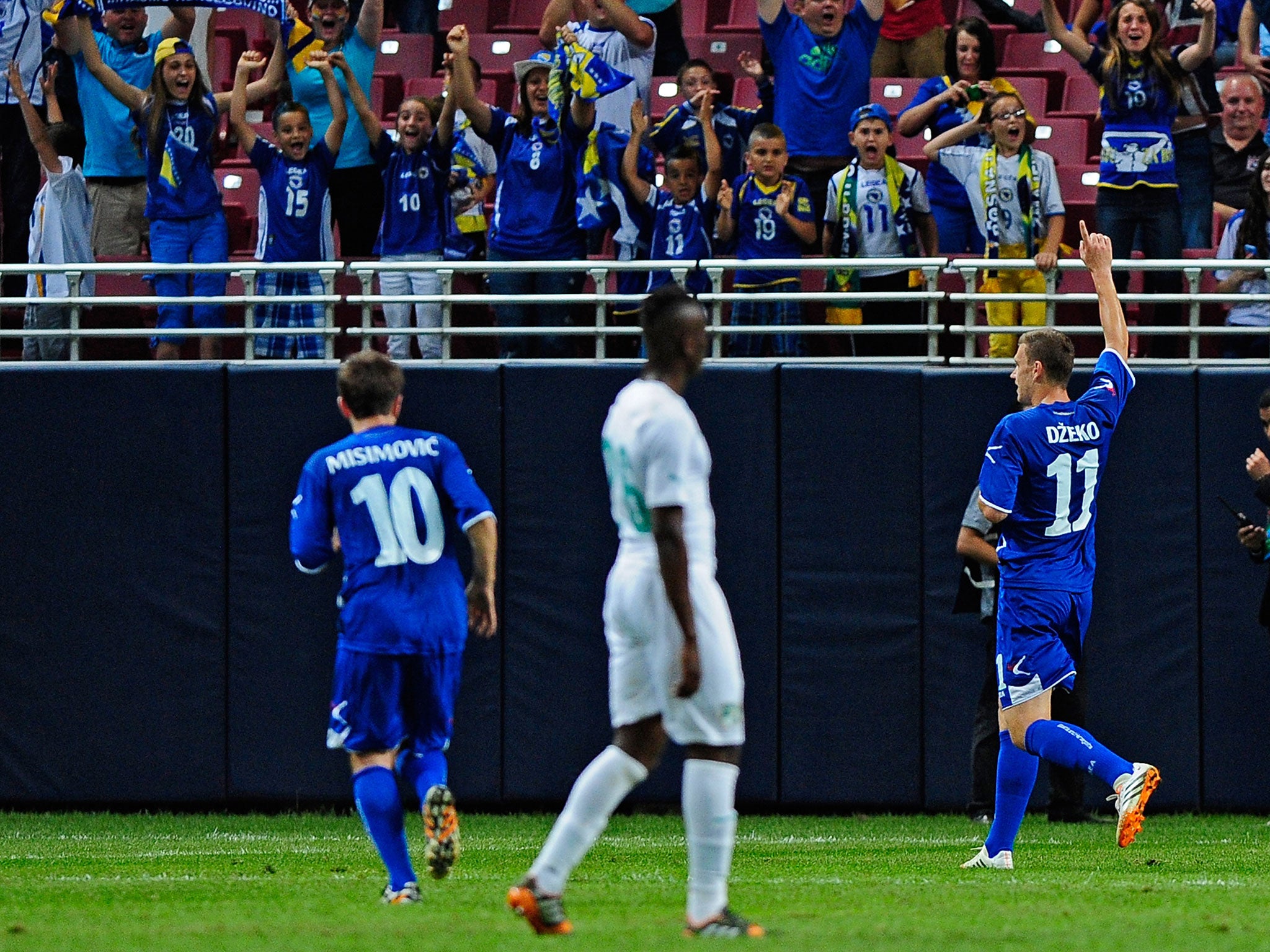 Edin Dzeko #11 of Bosnia-Herzegovina celebrates a goal against the Ivory Coast during the first half of a friendly match at Edward Jones Dome