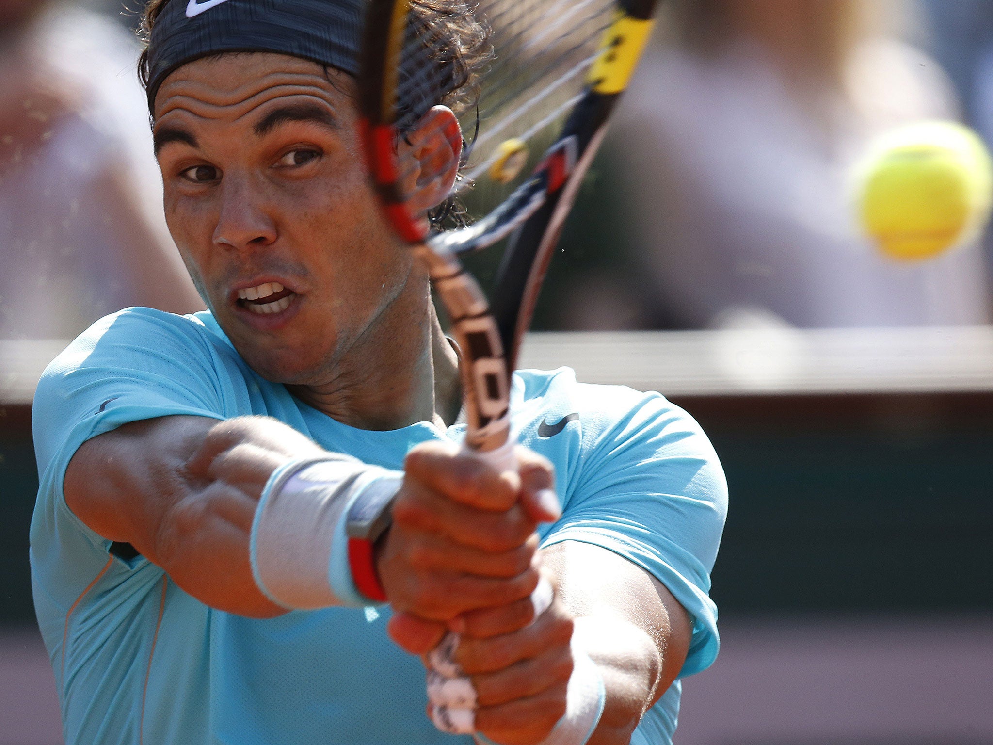 Spain's Rafael Nadal hits a return to Argentina's Leonardo Mayer during their French tennis Open third round match at the Roland Garros