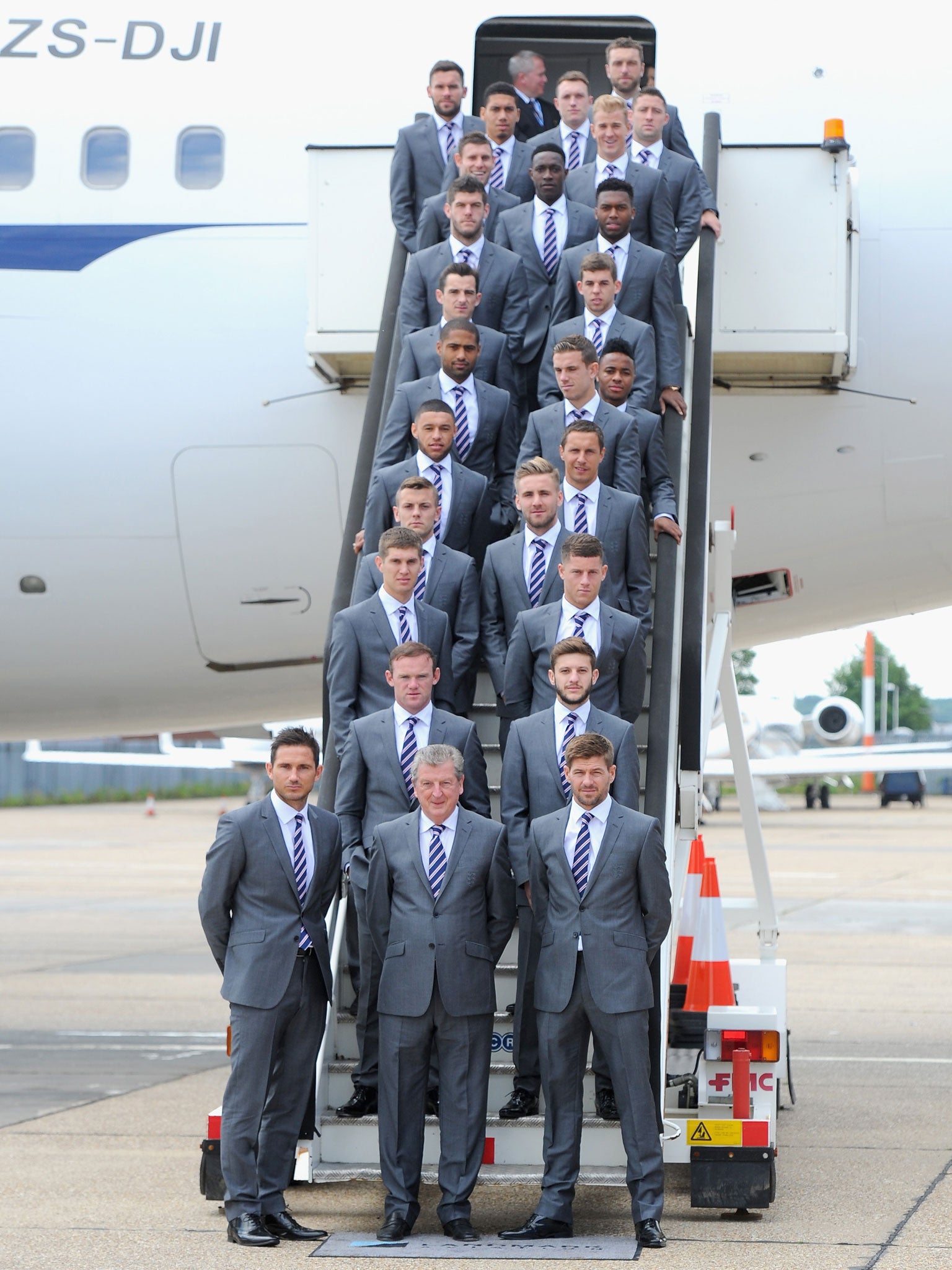 The England squad on the steps of their plane