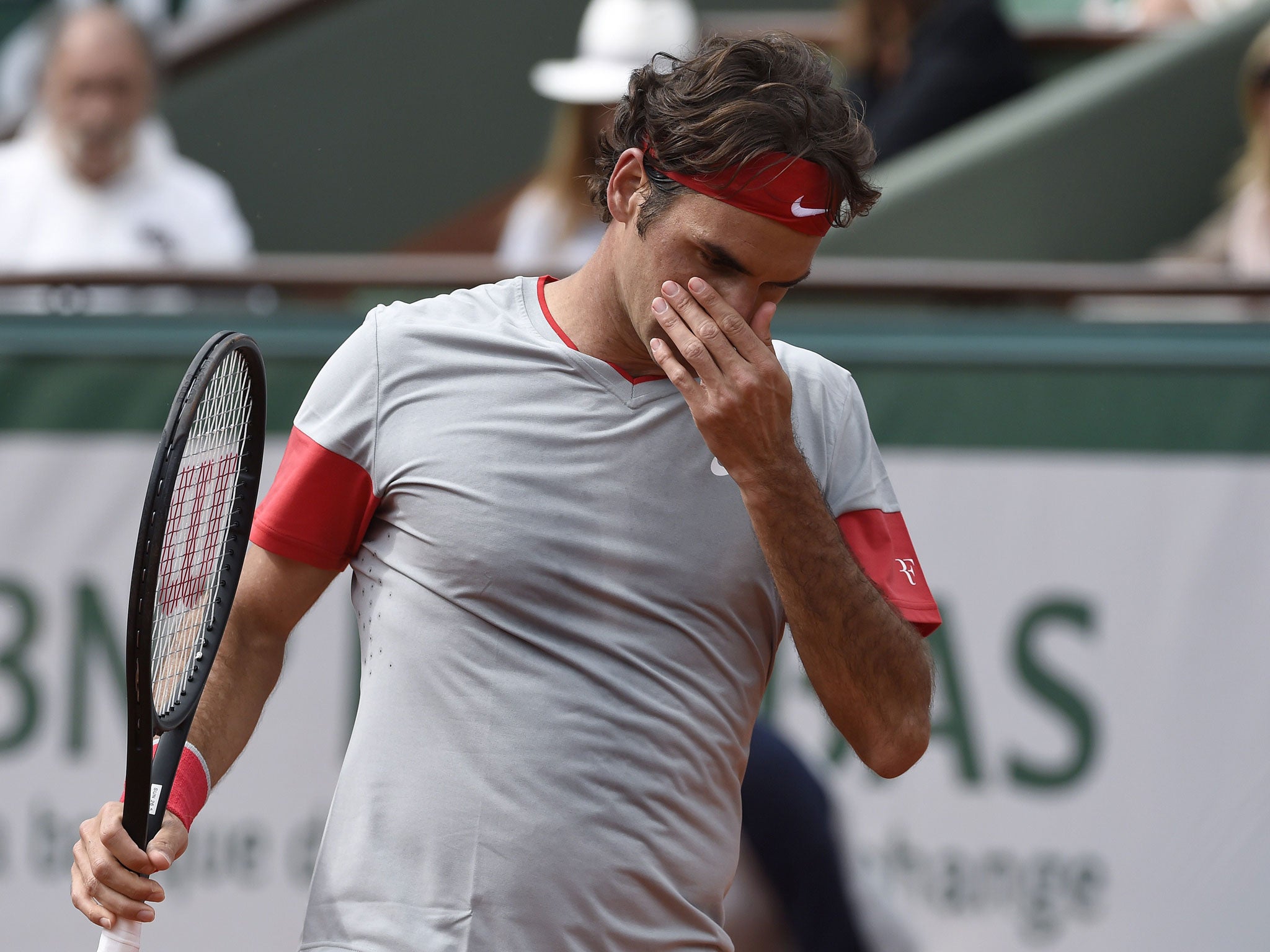 Switzerland's Roger Federer reacts after losing a point