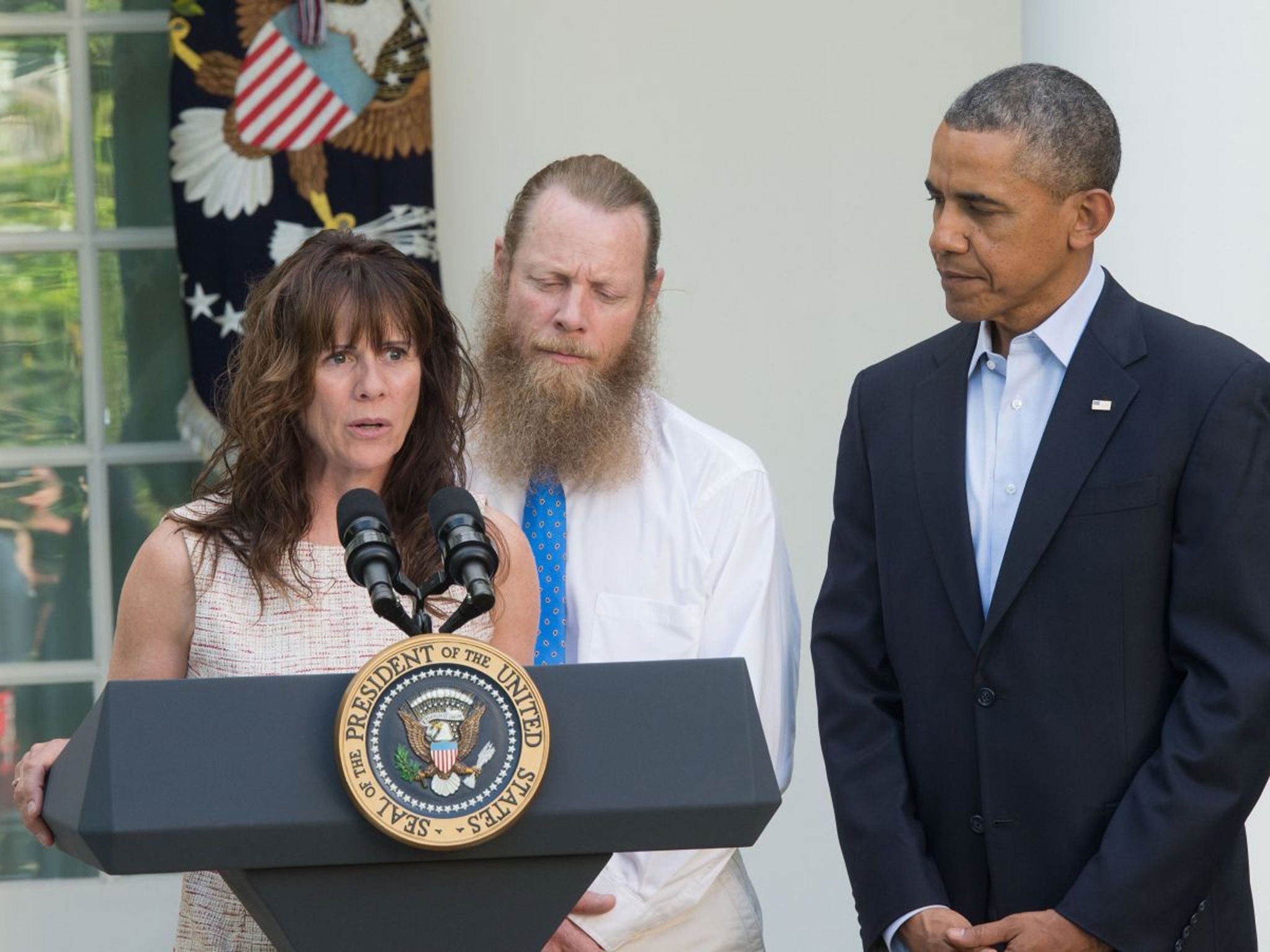 Jani Bergdahl makes a statement about the release of her son Sgt. Bowe Bergdahl as her husband Bob Bergdahl and President Barack Obama listen May 31, 2014 in the Rose Garden at the White House in Washington, DC