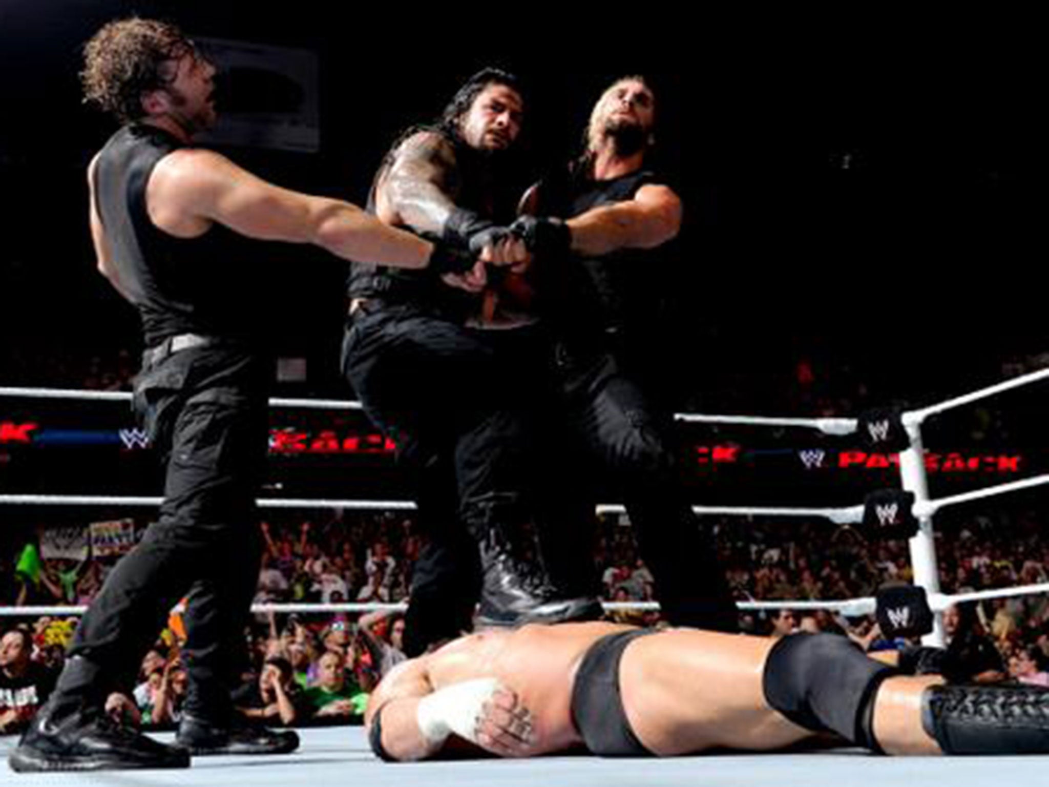 The Shield celebrate their victory over Evolution at Payback