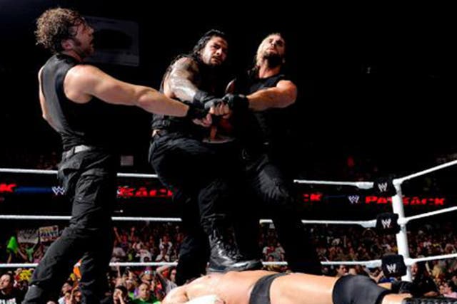 The Shield celebrate their victory over Evolution at Payback