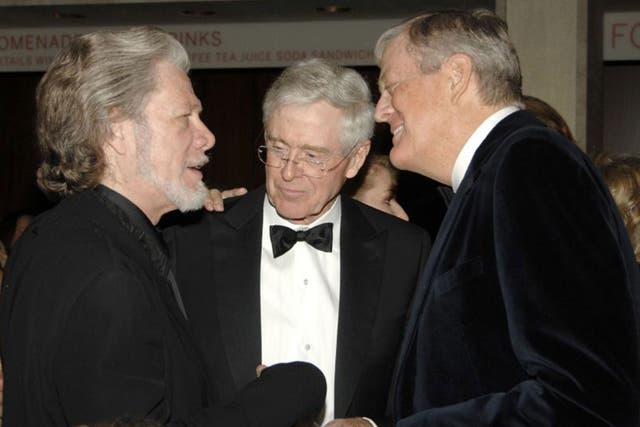 Power brokers: brothers Charles, centre, and David Koch, right, head the family firm