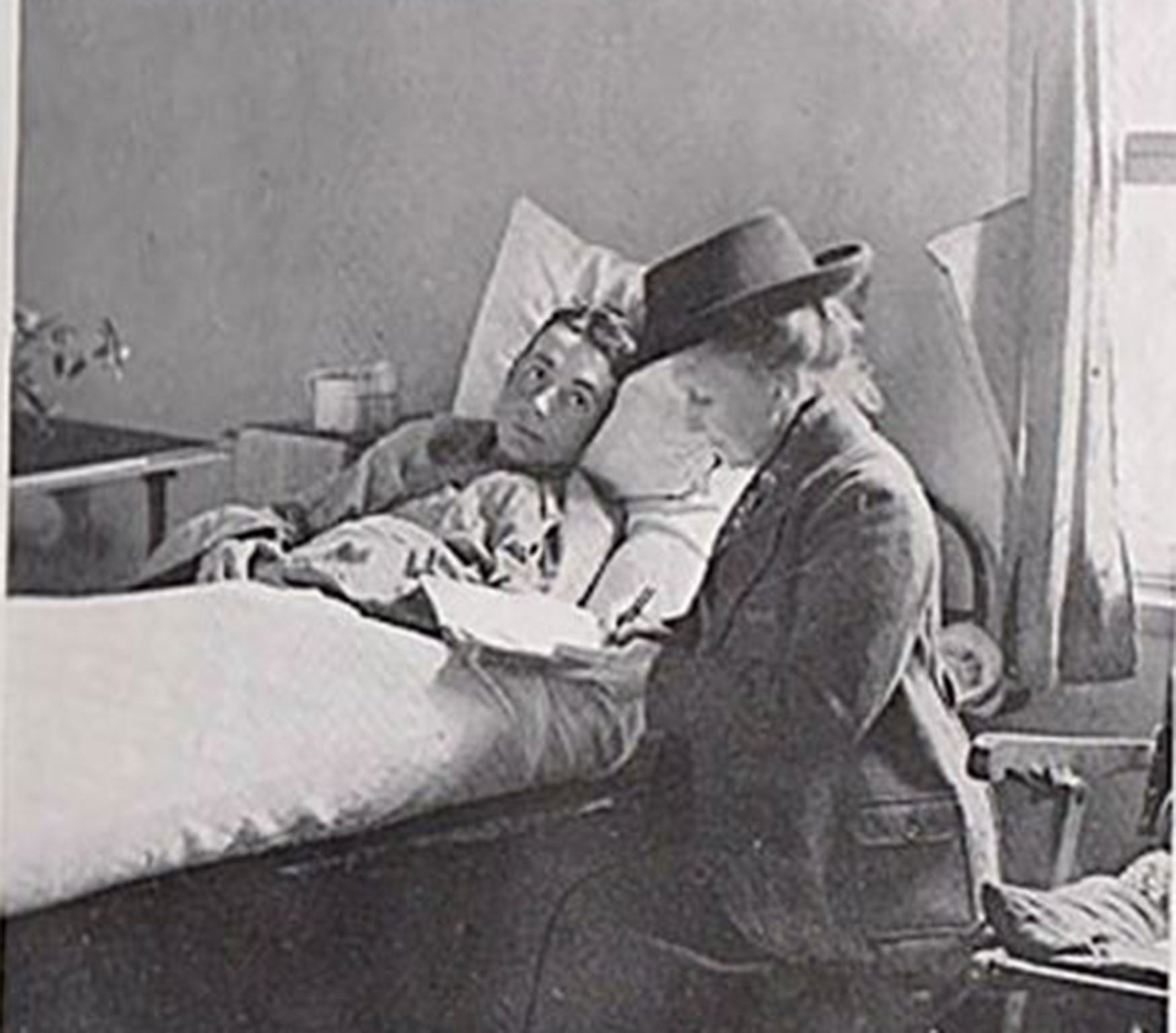 May Bradford writing a letter for an injured soldier in a French hospital