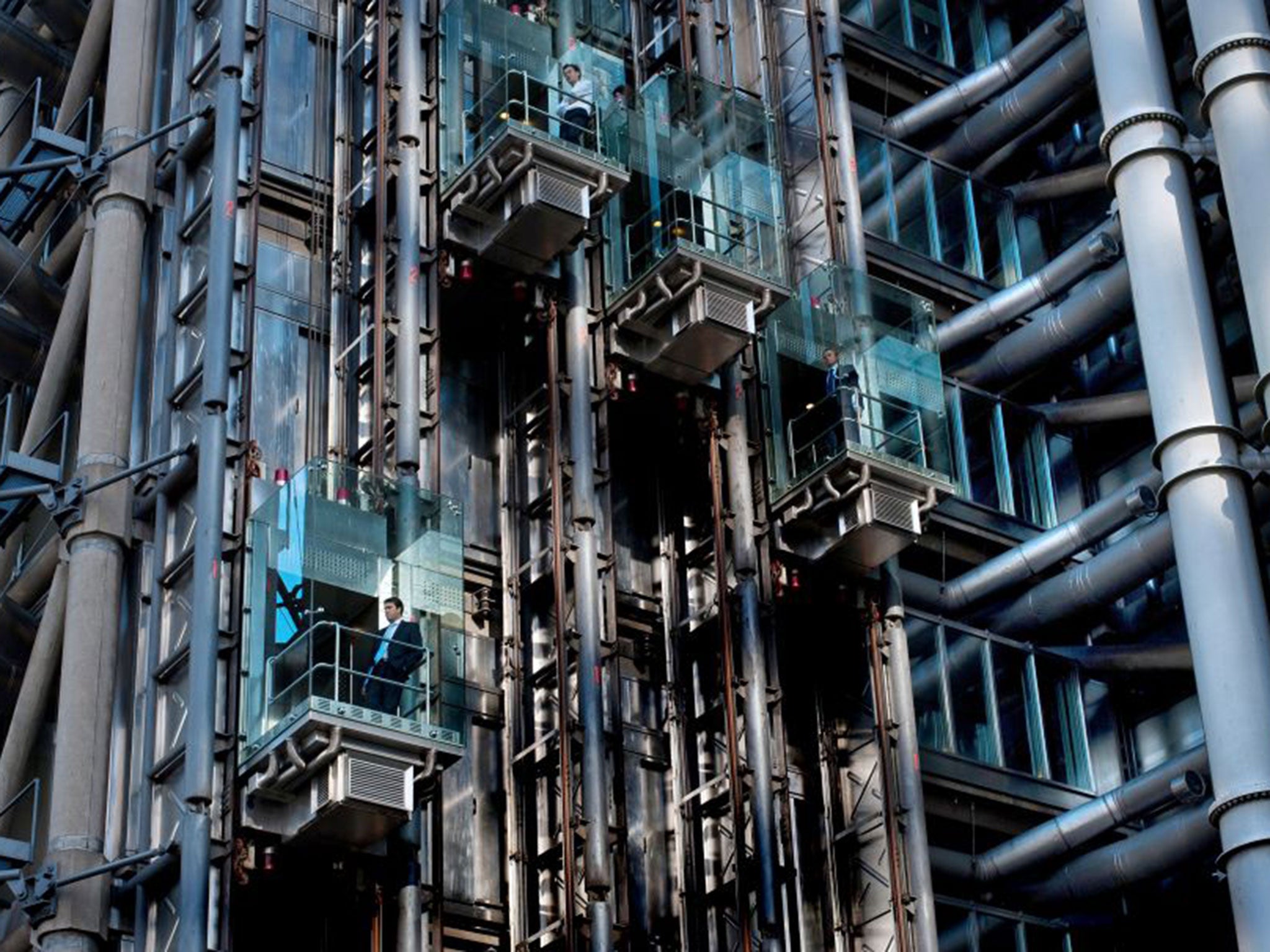 The “inside-out” glass lifts are an iconic feature of the building