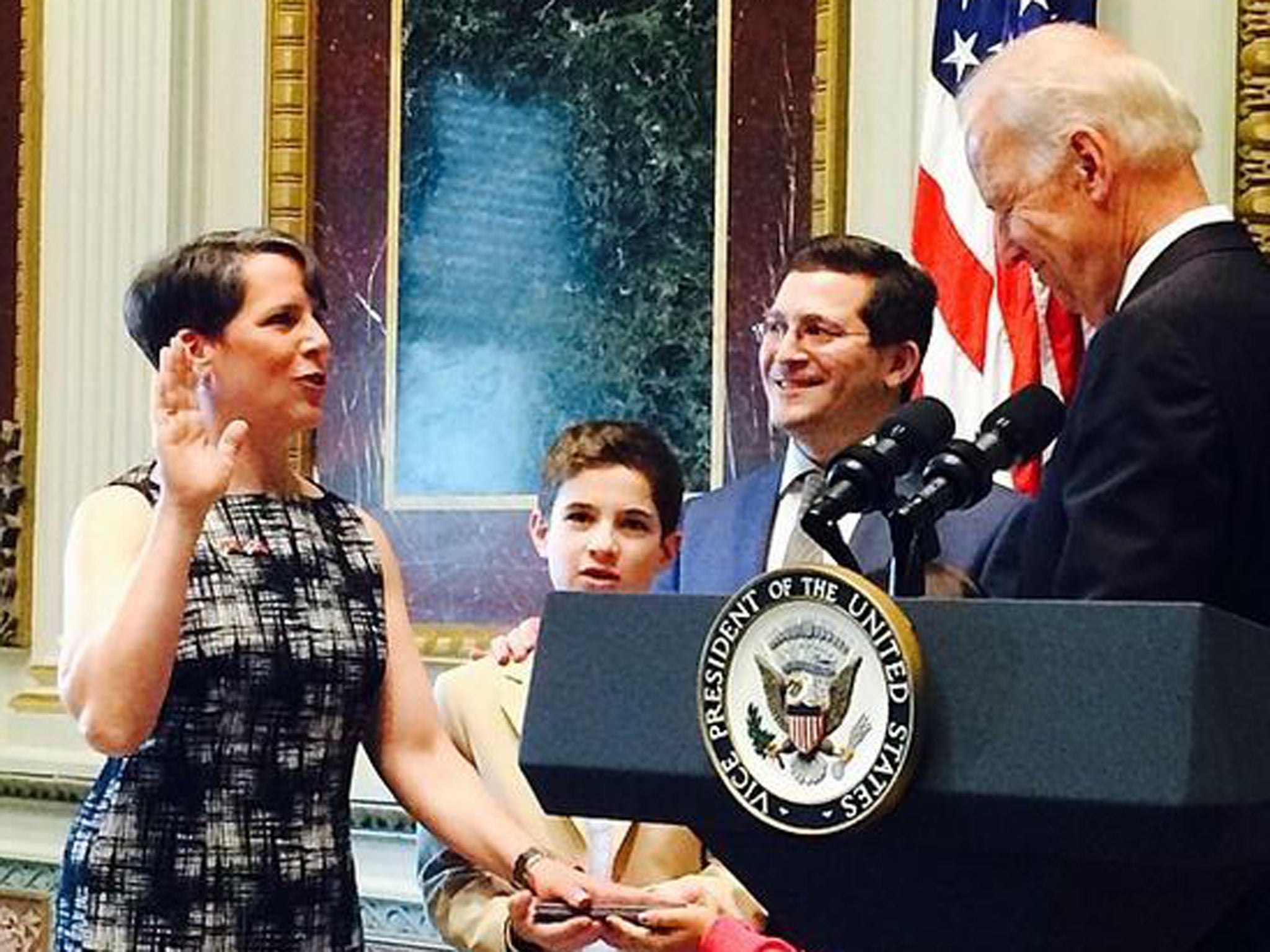 Suzi Levine is sworn in as Ambassador using an e-reader