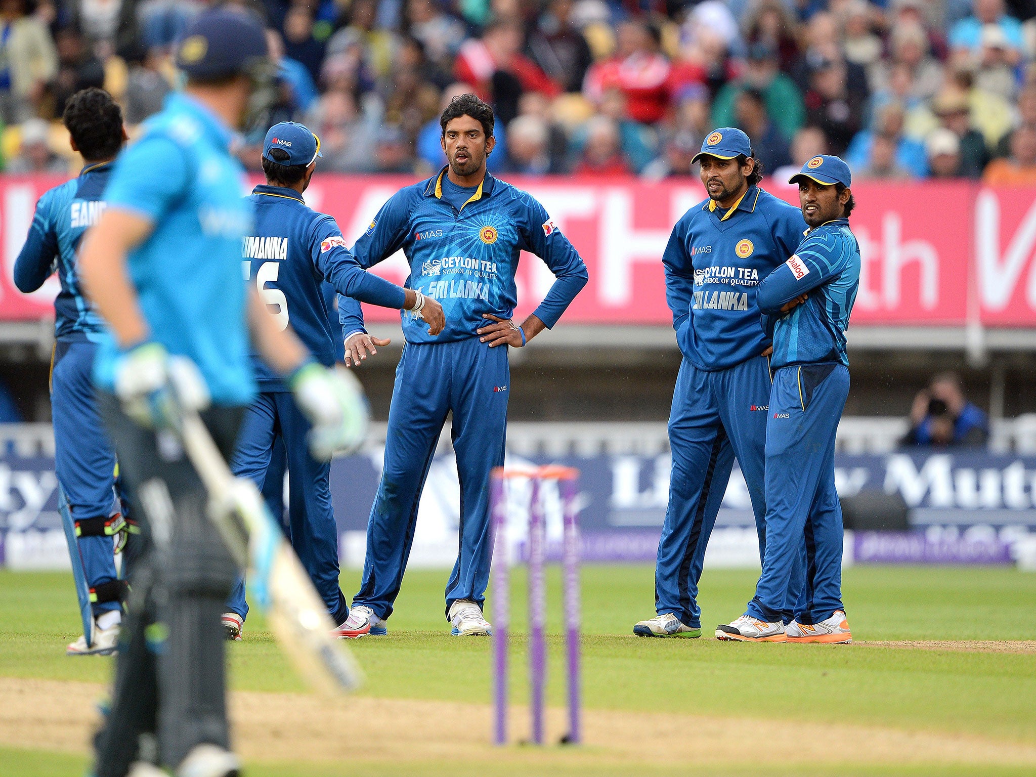 Sri Lanka's Sachithra Senanayake (3R) reacts after controversially running out England's Jos Buttler (L) during the fifth ODI at Edgbaston
