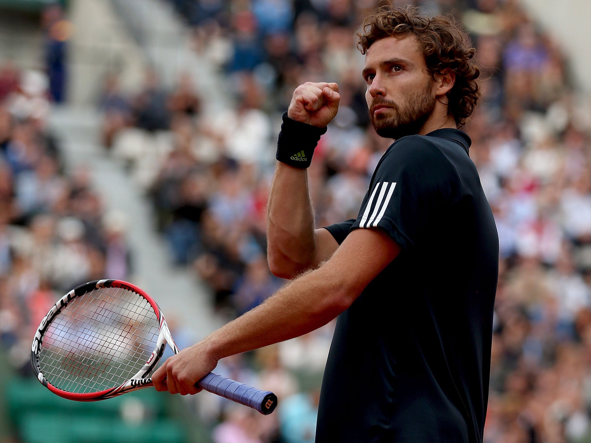 Ernests Gulbis of Latvia celebrates victory in his men's singles quarter-final match against Tomas Berdych of Czech Republic on day ten of the French Open