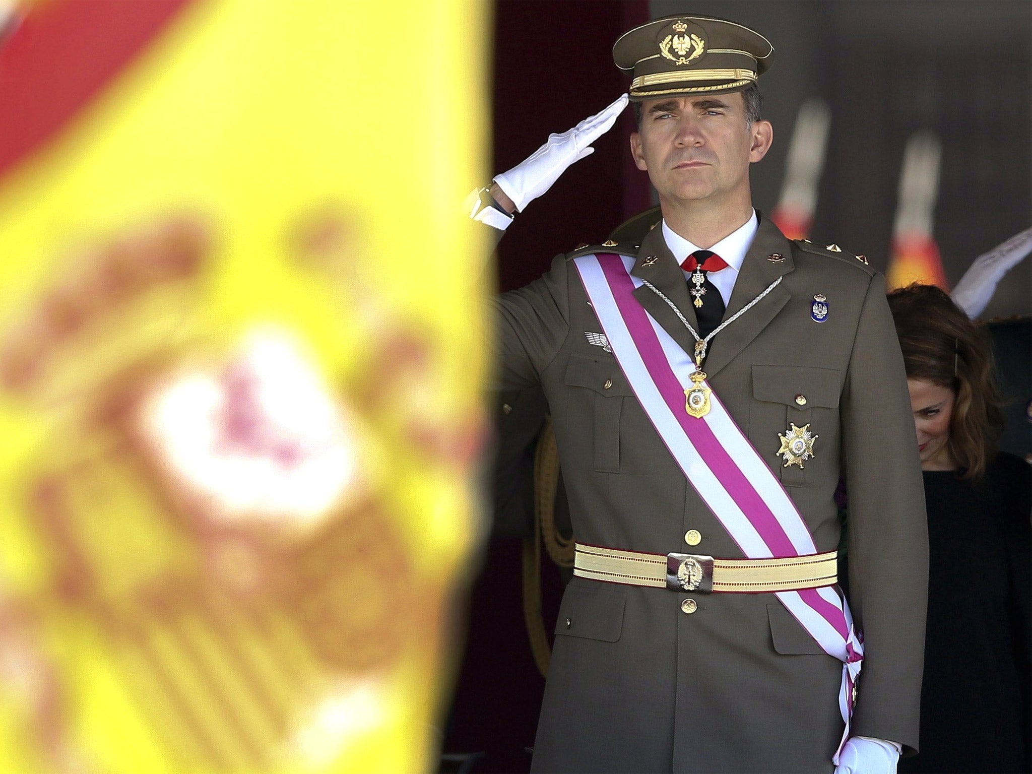 Spanish Crown Prince Felipe salutes at the national flag during a military ceremony of the San Hermenegildo Order