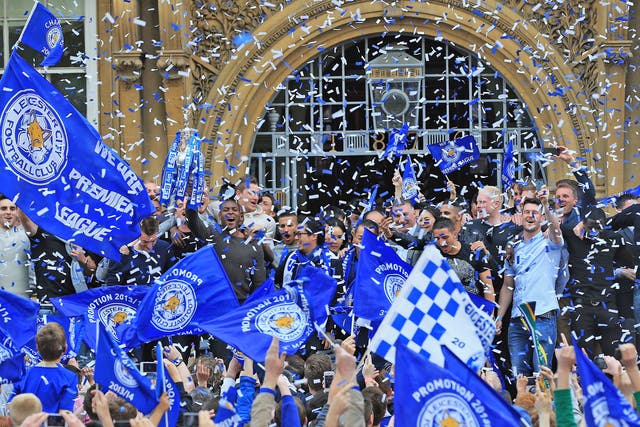 Leicester City celebrate winning the Championship - and with it promotion to the Premier League