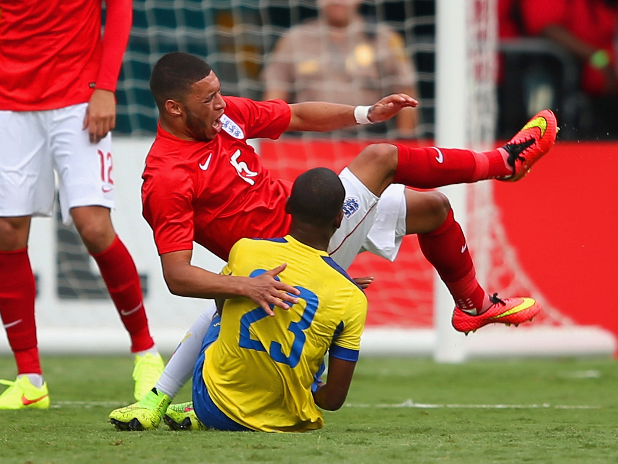 Alex Oxlade-Chamberlain goes down in pain under a challenge from Carlos Gruezo