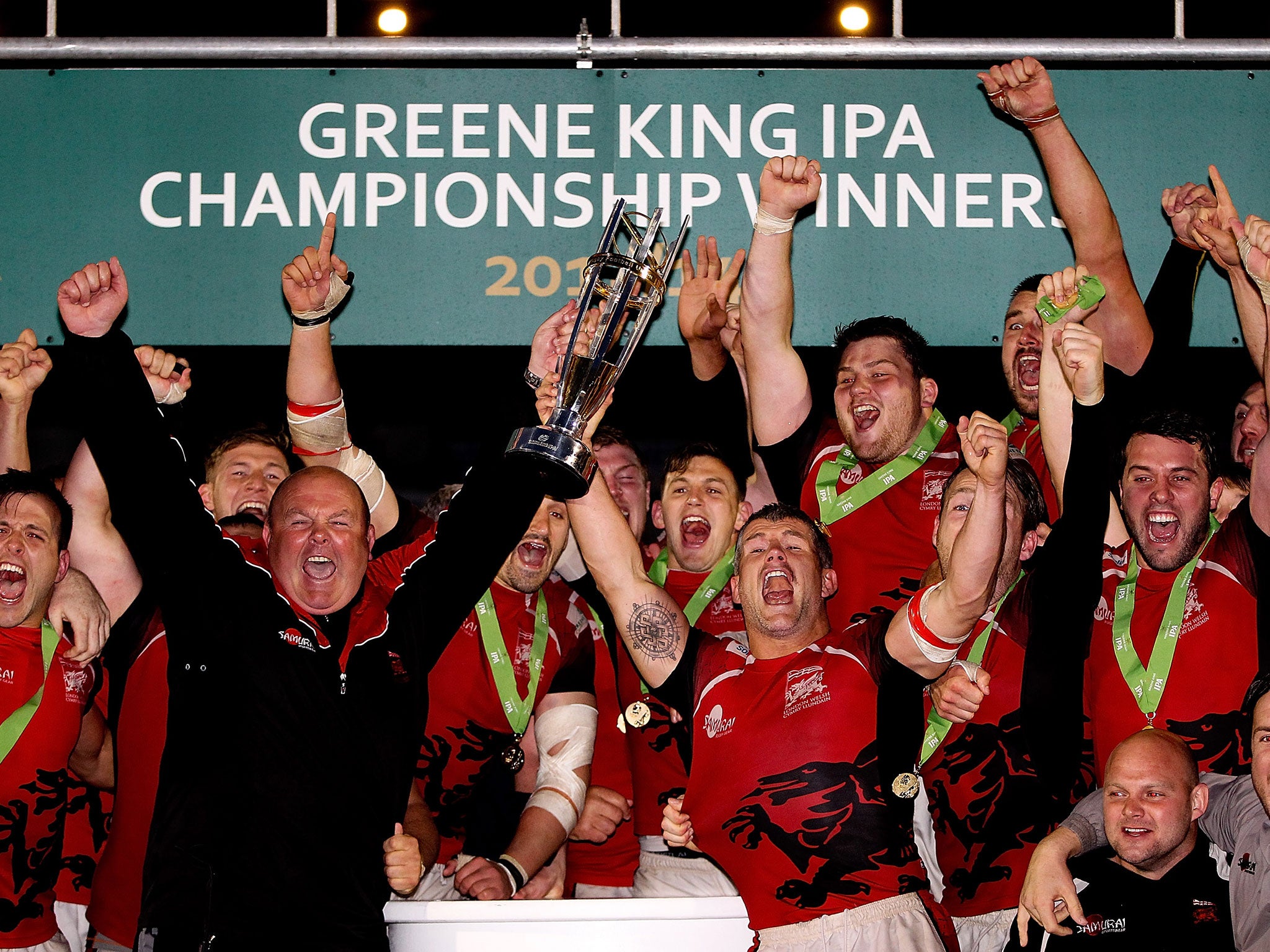 London Welsh head coach Justin Burnell and Catain Tom May lift the trophy following the Greene King IPA Championship play off final second leg match between Bristol