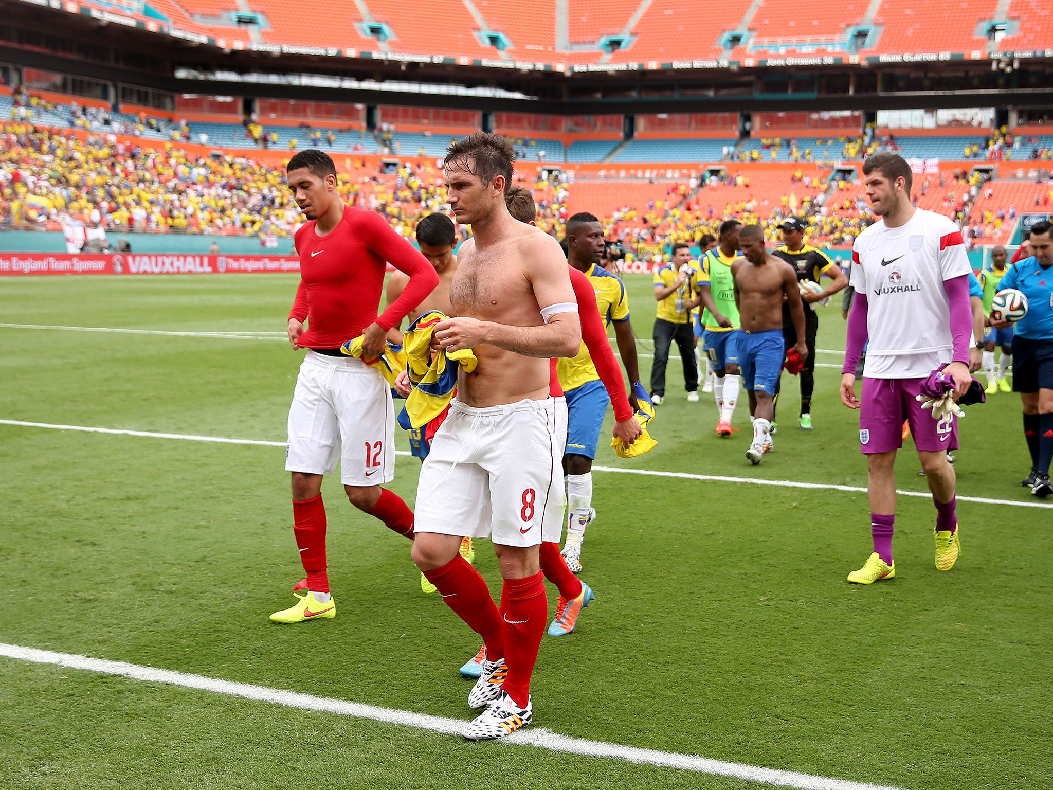 Frank Lampard leads England off the field in Miami following their 2-2 draw with Ecuador