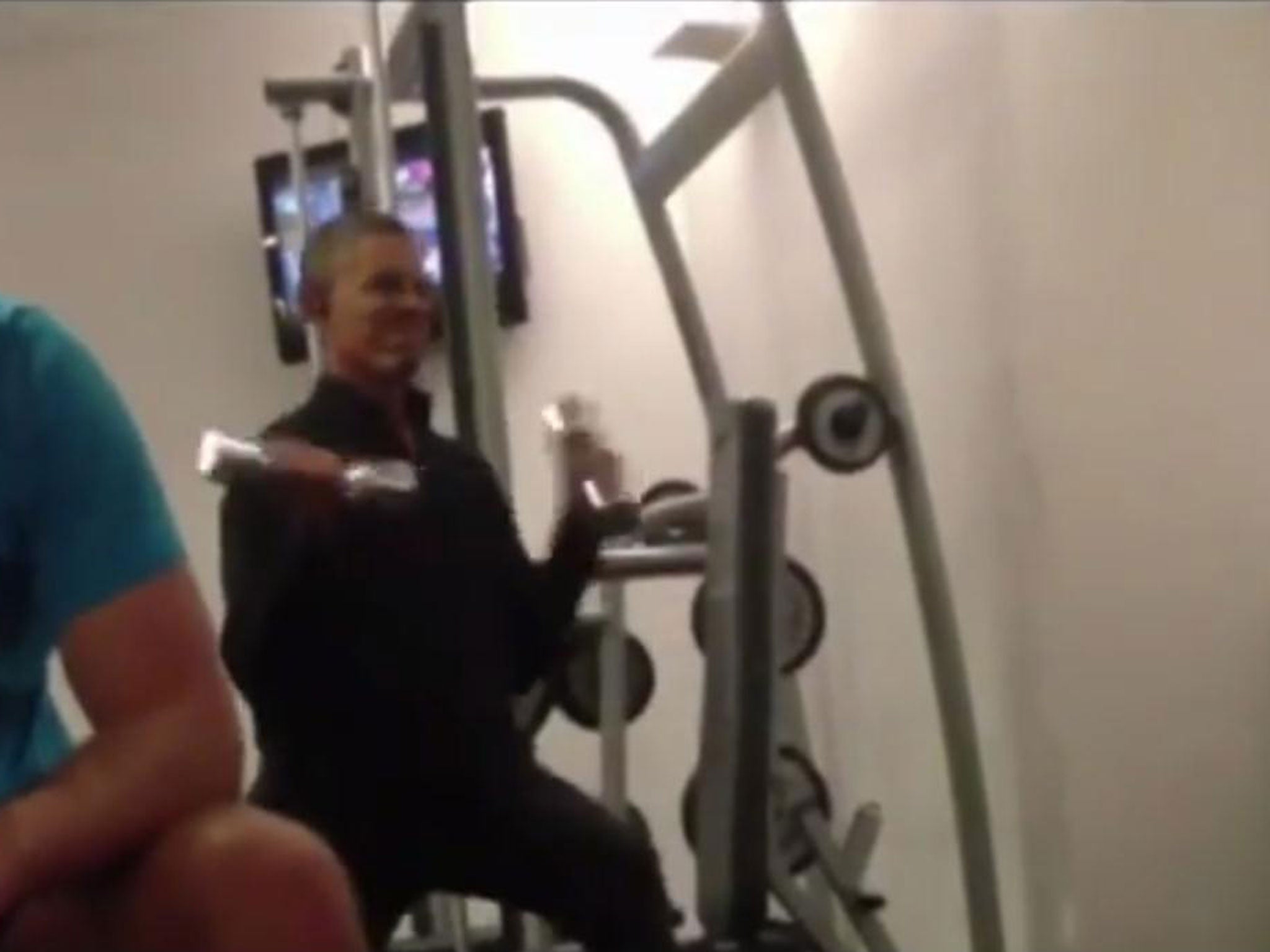 President Obama flexing some muscle at the gym