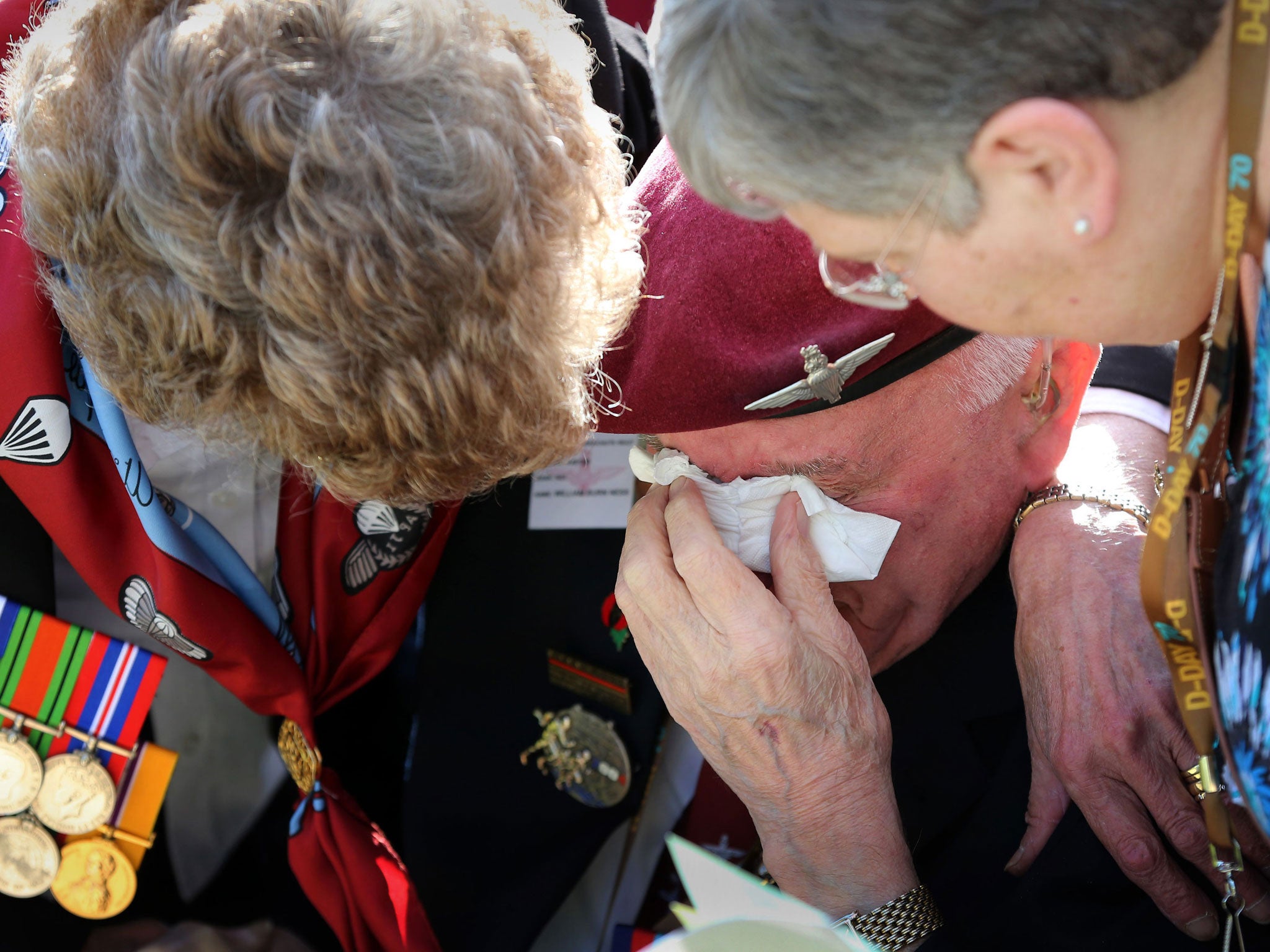 William Ness, 12th Yorkshire Parachute Battalion, is overcome during a commemorative ceremony at Memorial Pegasus near Ouistreham, France, as veterans mark the 70th anniversary of the D-Day landings during World War II