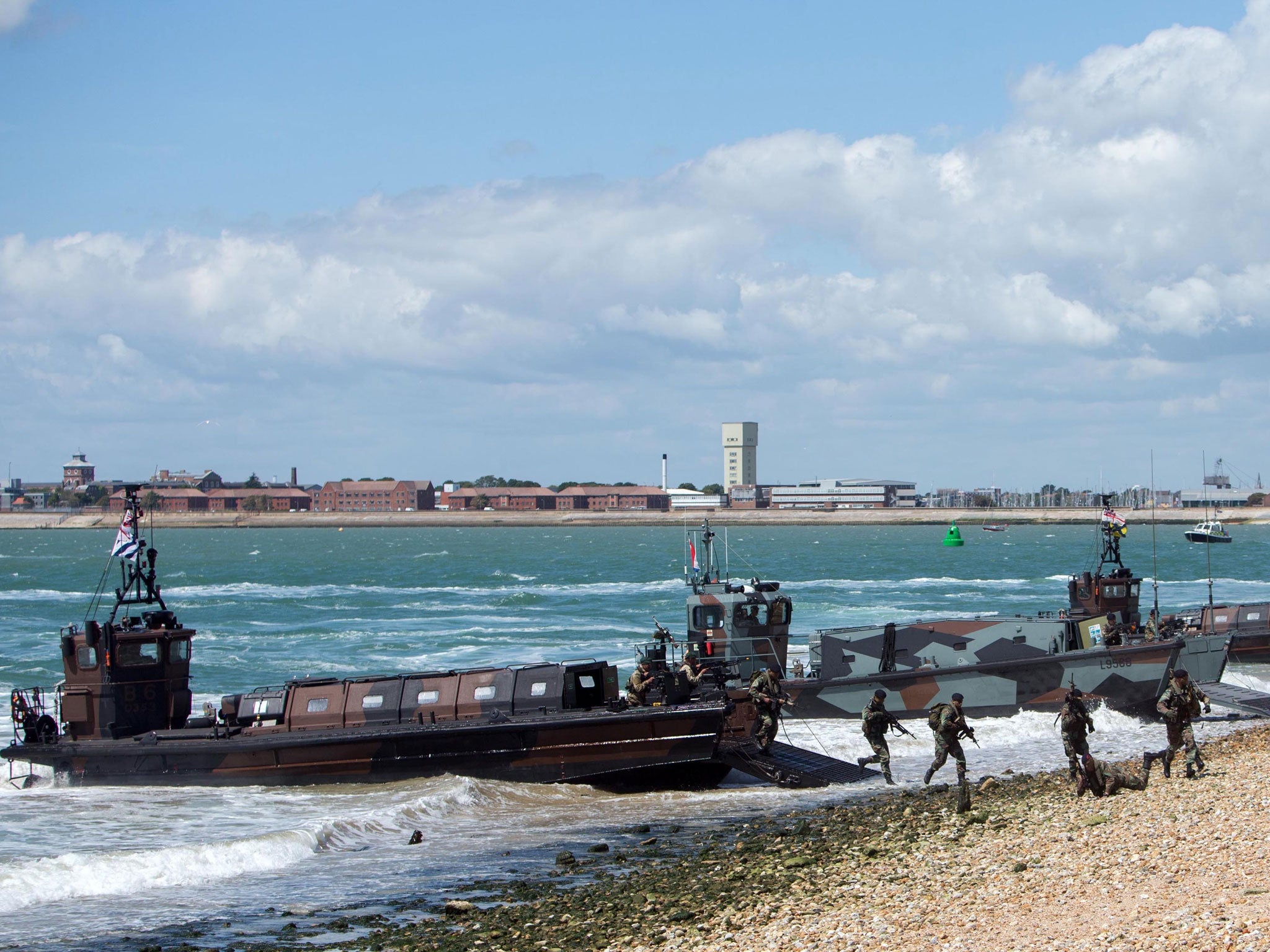 British Marines and their Dutch counterparts demonstrate a beach assault near Southsea Common in Hampshire to mark the 70th Anniversary of the D-Day landings