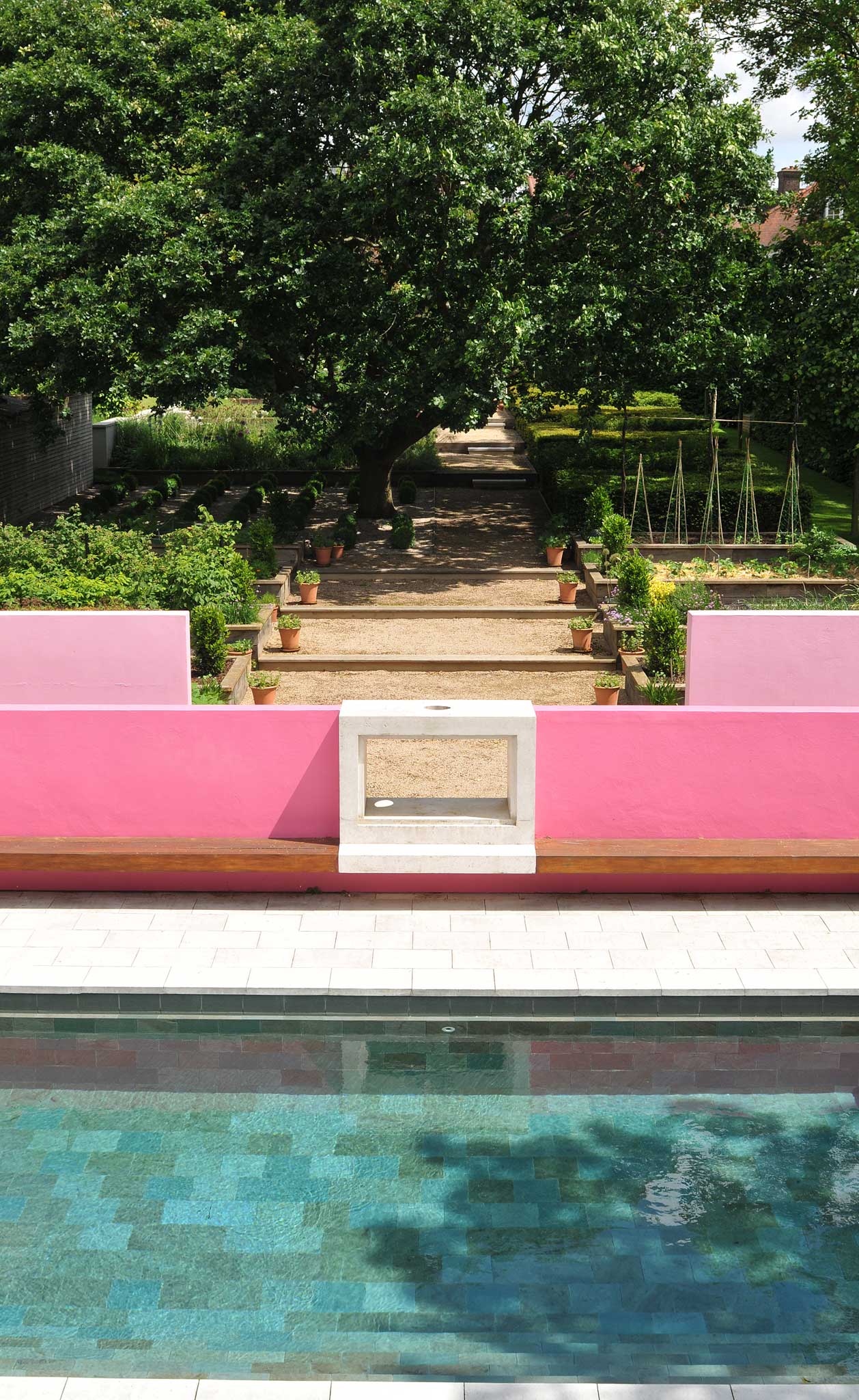 Helen Marsden's garden features gravel steps leading up to the slate-lined pool