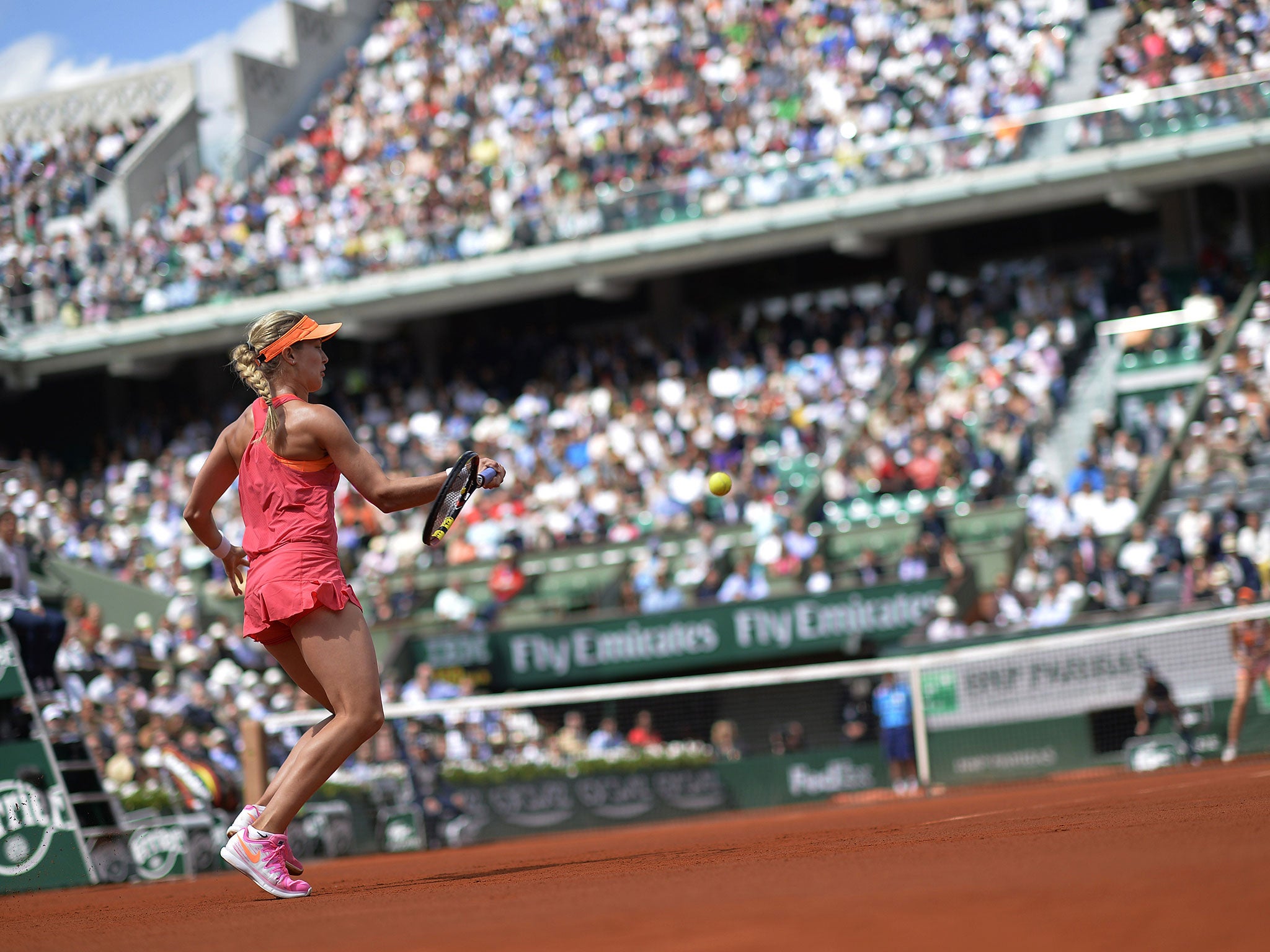 Canada's Eugenie Bouchard returns the ball to Russia's Maria Sharapova during their French tennis Open semi-final