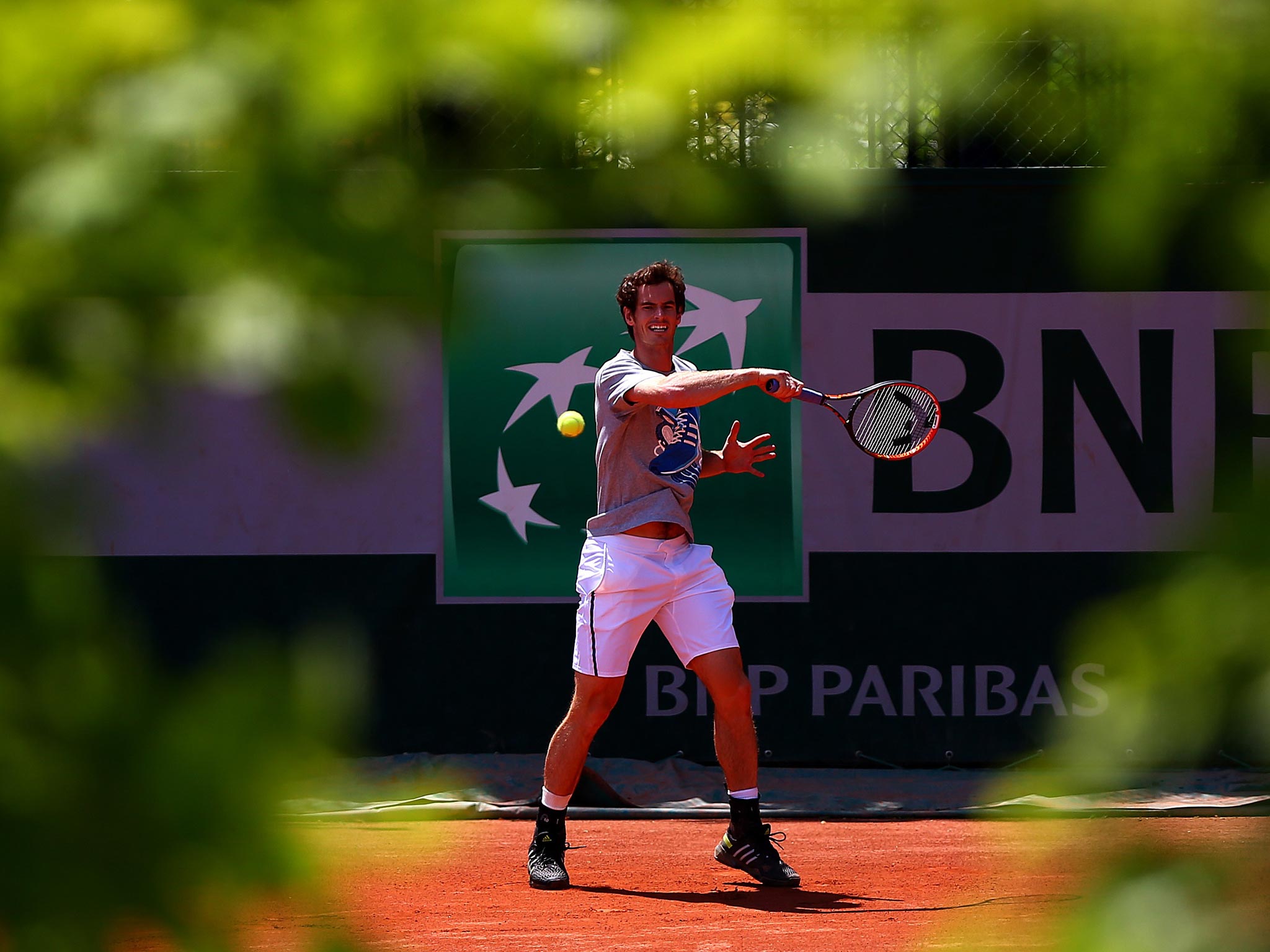 Andy Murray returns a shot during a practice session at Roland Garros yesterday, hoping to deny the world No 1 Rafa Nadal a ninth French Open final place