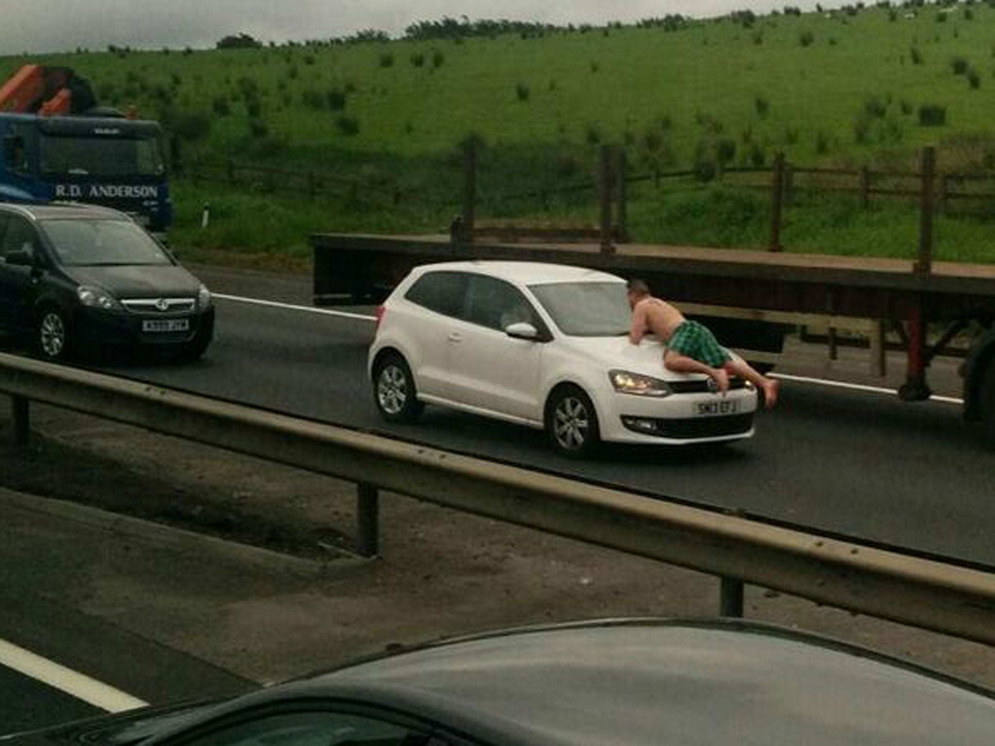 A man caused traffic chaos this morning when he was found wandering along the M8 wearing nothing but green tartan underpants