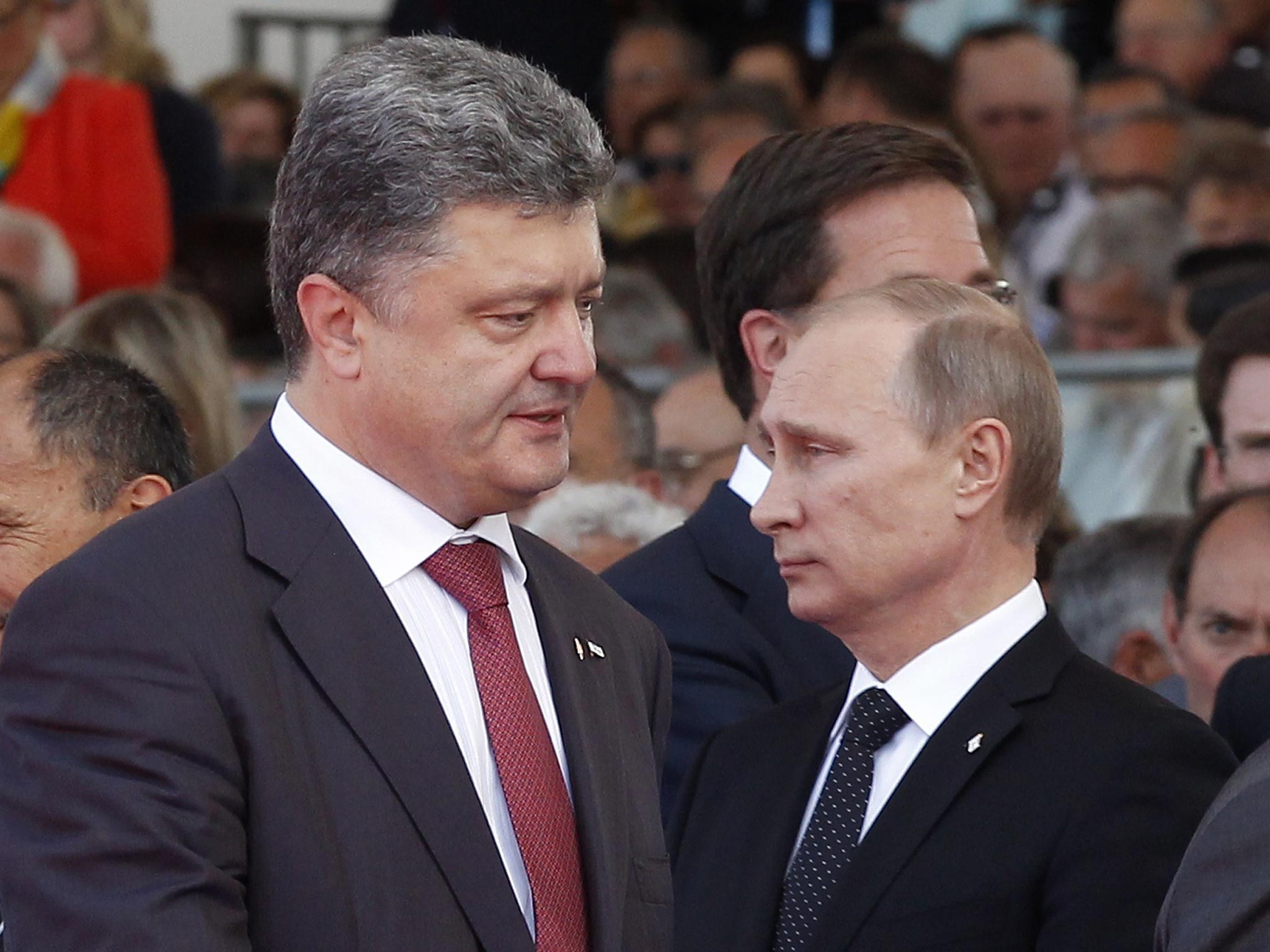 Ukraine's President-elect Petro Poroshenko (left) and Russian President Vladimir Putin during an international D-Day commemoration ceremony 