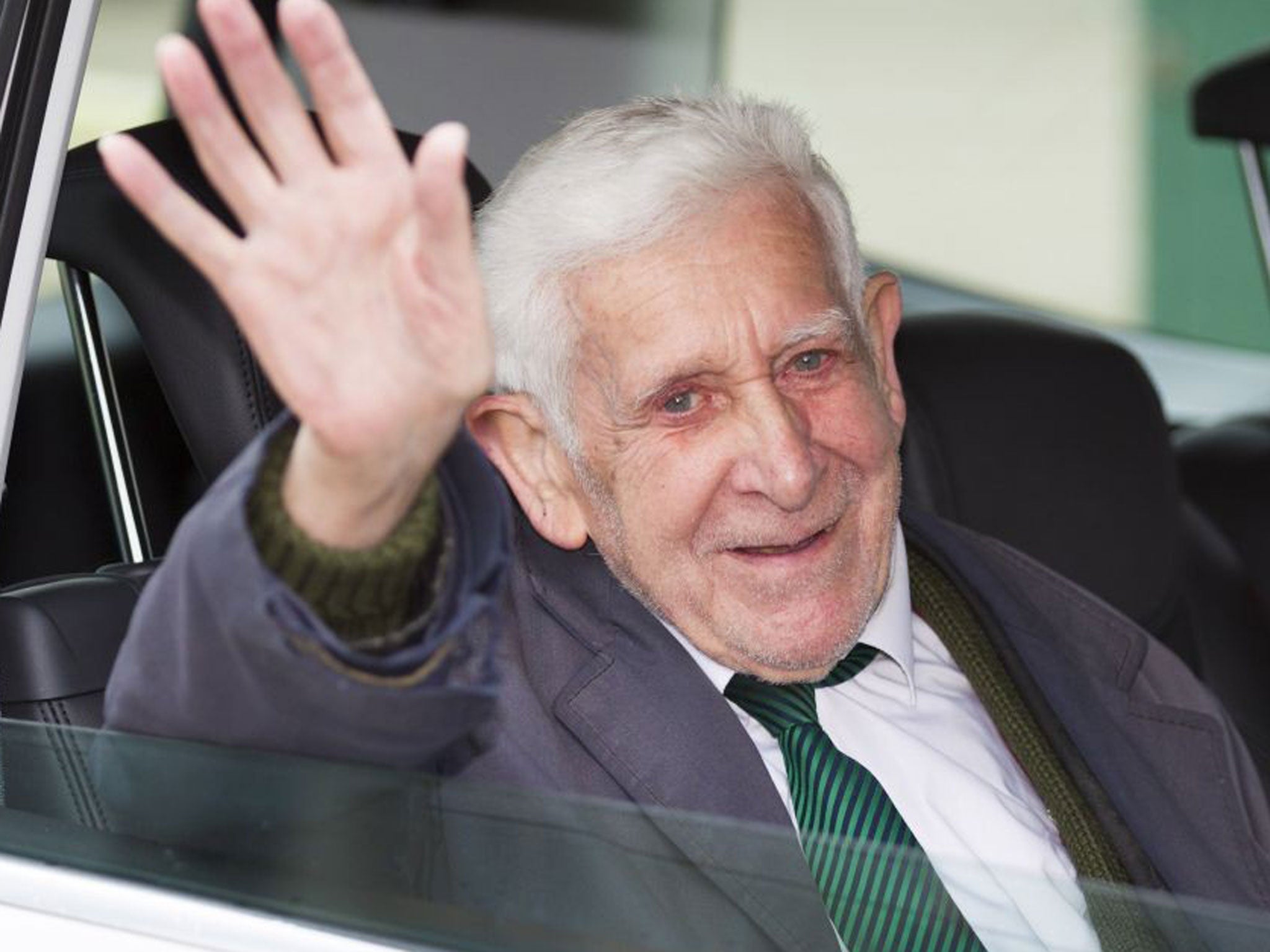 Bernard Jordan, the 90-year-old war veteran found in Normandy after being reported missing from his care home in Hove, Sussex, waves as he returns to Portsmouth on a Brittany Ferry