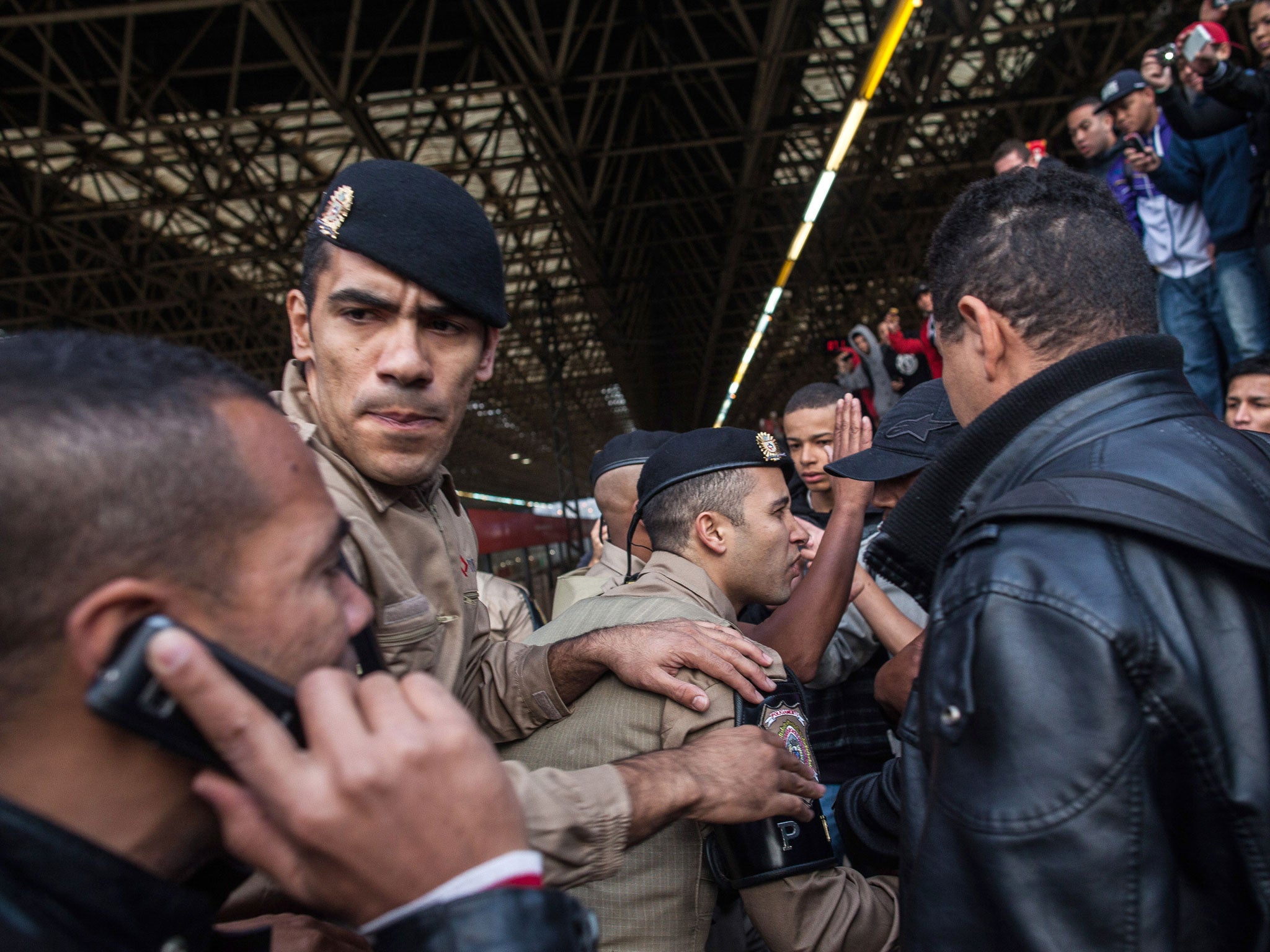 Police and strikers clash after second day of industrial action on Sao Paulo's underground