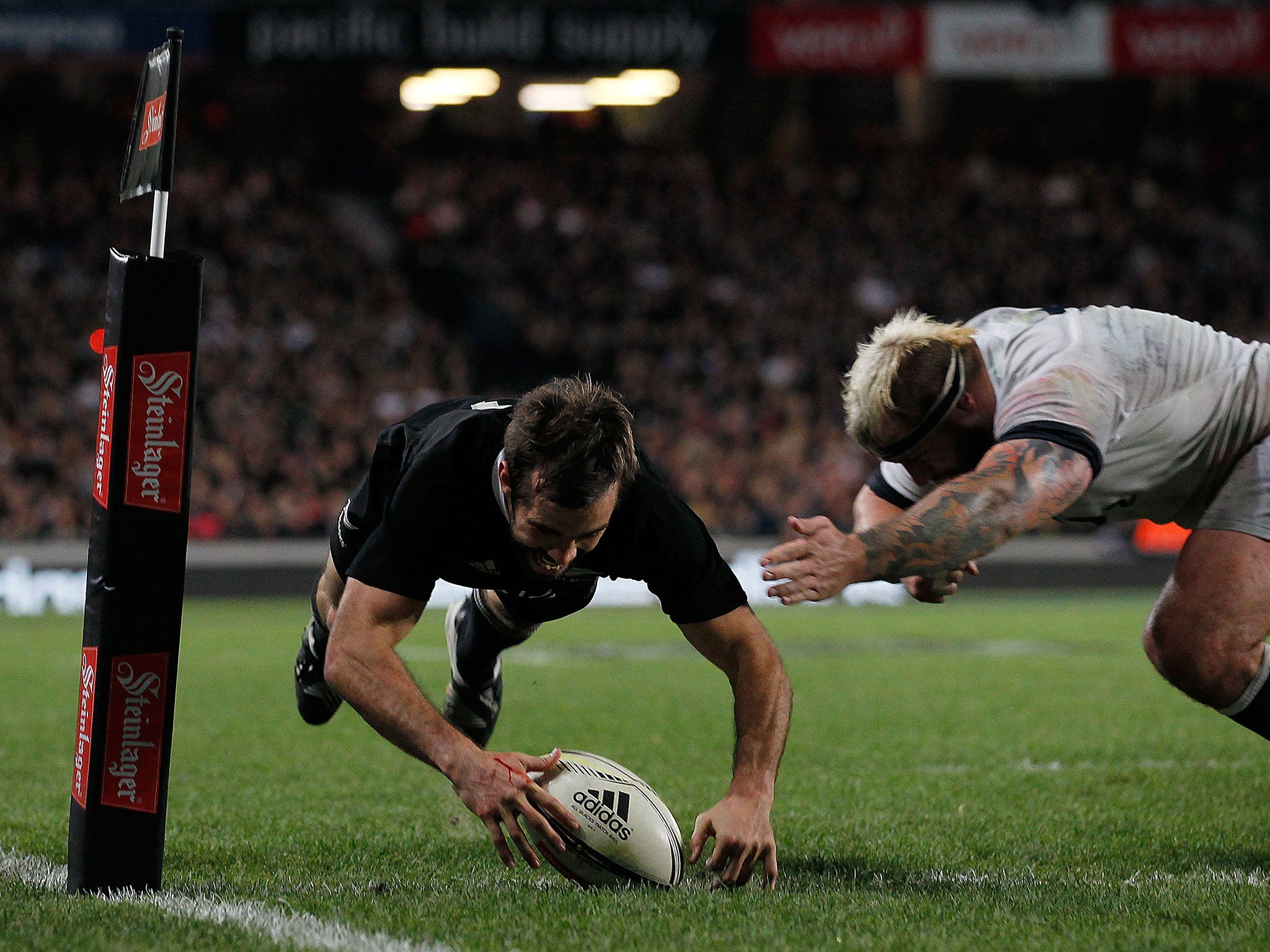 Conrad Smith scores the match-winning try for New Zealand in their 20-15 victory over England