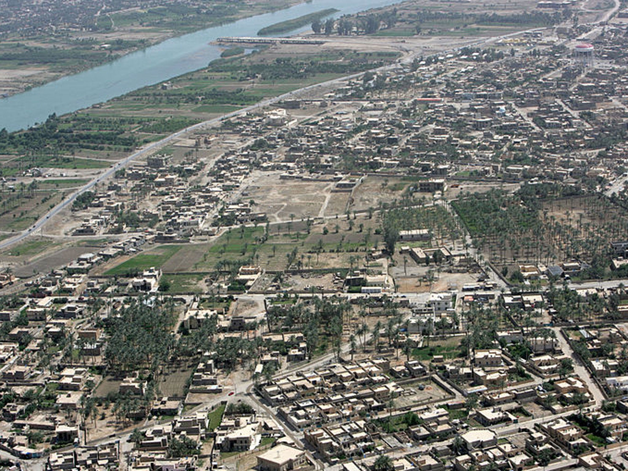 An aerial view of the Euphrates River in Ramadi. Gunman have stormed a university in Iraq and taken dozens of students hostage inside a dormitory at Anbar university