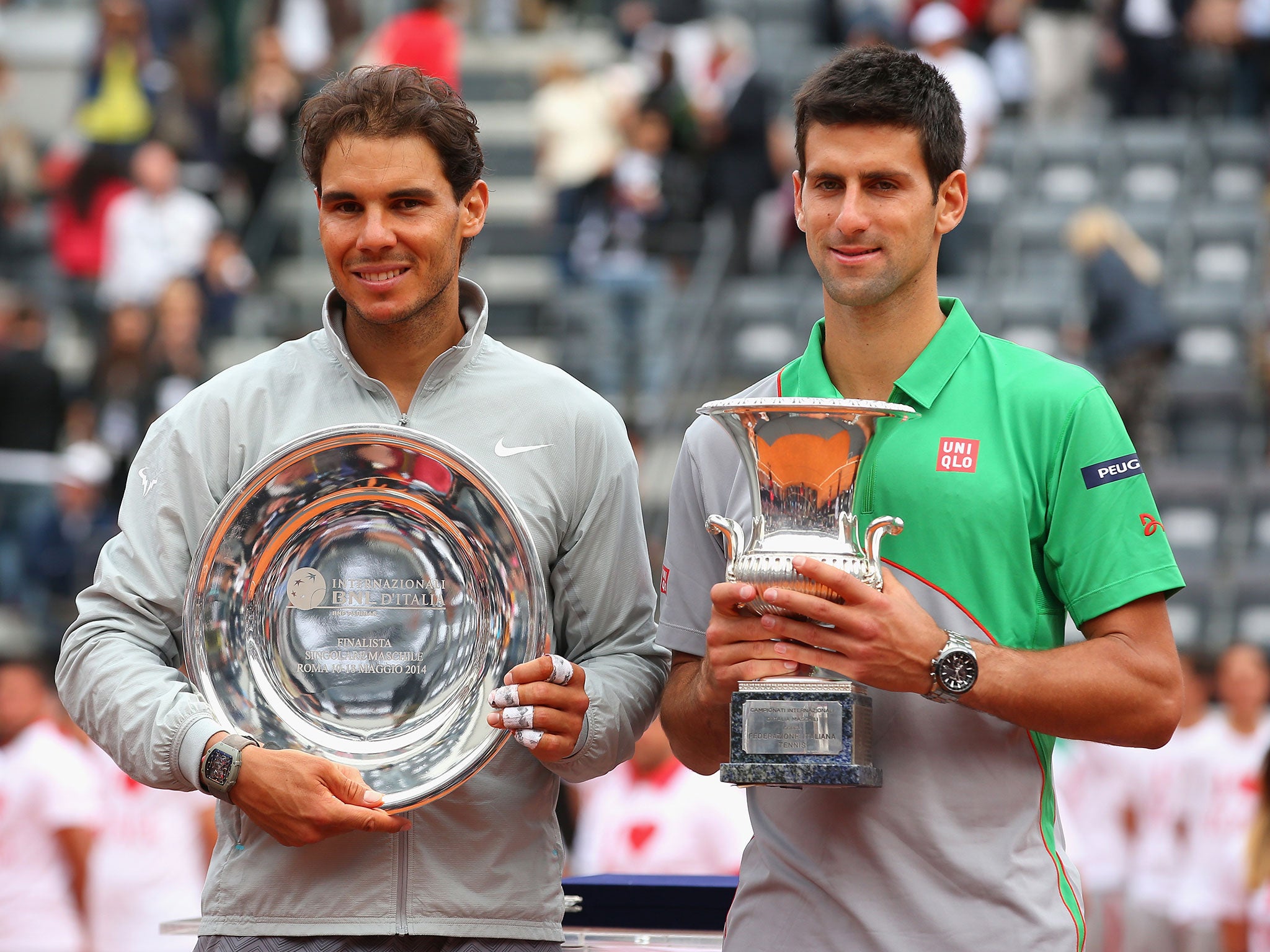 Novak Djokovic of Serbia with the winners trophy next to runner up Rafael Nadal of Spain after the final during day eight of the Internazionali BNL d'Italia