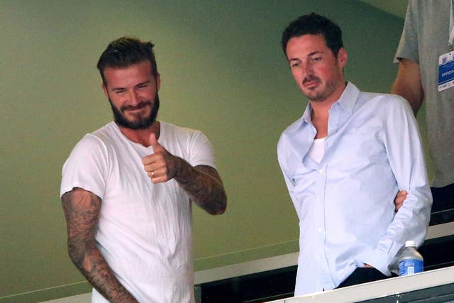 David Beckham gives the thumbs up at Miami's Sun Life Stadium as he watches the goalless draw between England and Miami