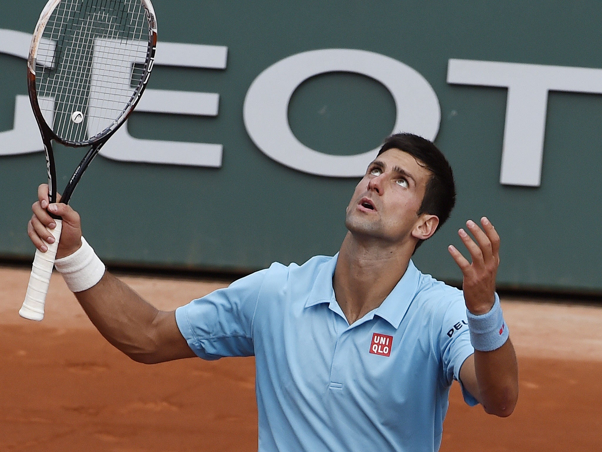 Novak Djokovic reacts after losing a point in his French Open defeat to Rafael Nadal