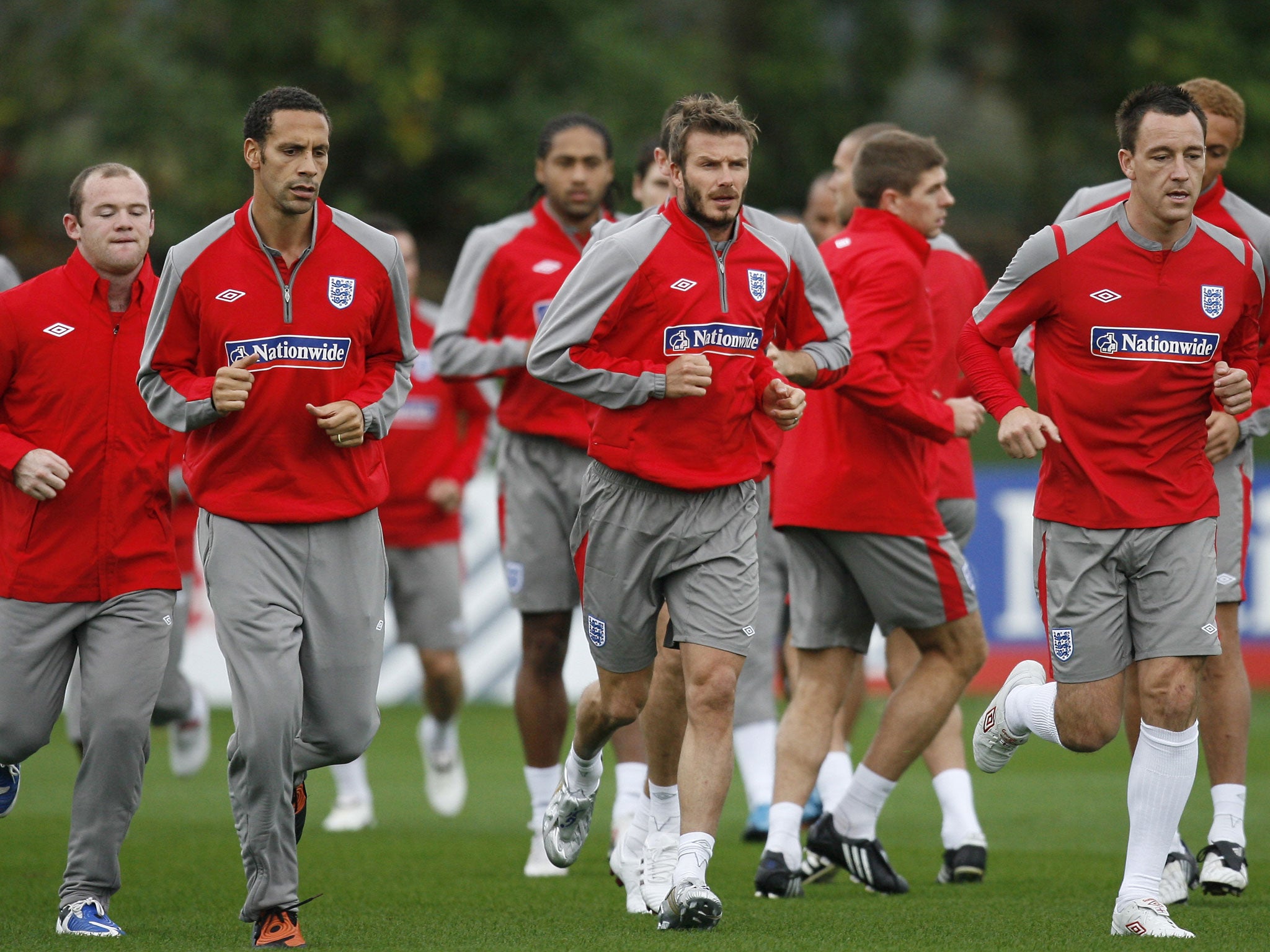 Classic casuals:David Beckham leads the England squad in training in 2009