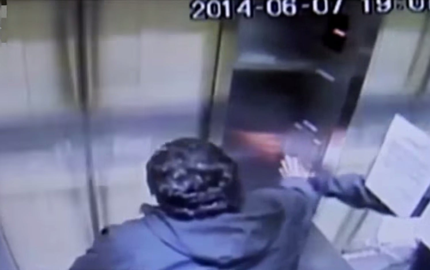 The passenger desperately tried to hit the lift's emergency stop button