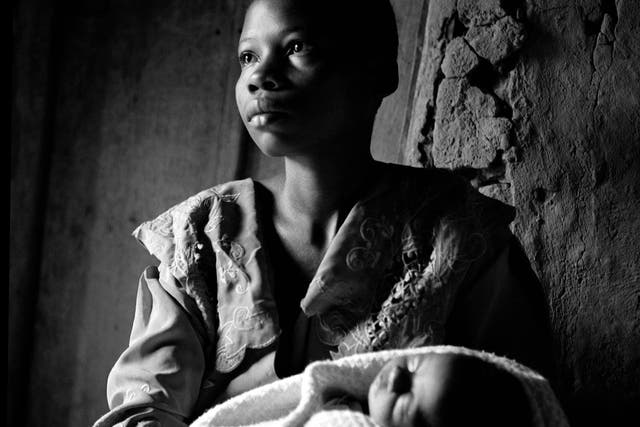 19 year-old Brigitte with her baby boy Damas, conceived when she was raped. Damas died shortly after this was taken. Photograph by Fiona Lloyd-Davies
