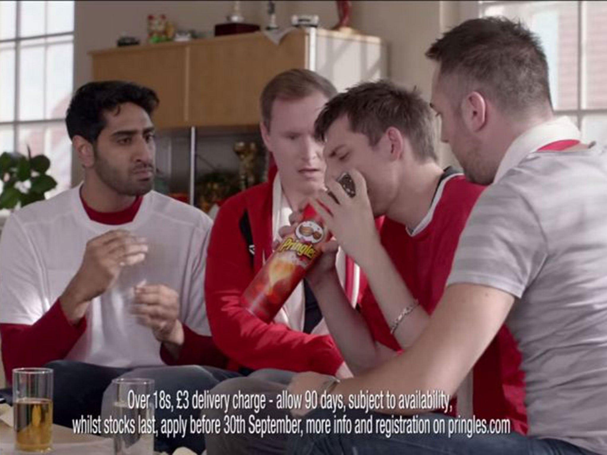 An advert for Pringles showing football-loving men avoid their ‘killjoy’ girlfriends by pretending their mobile phones are losing signal