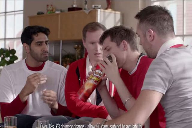 An advert for Pringles showing football-loving men avoid their ‘killjoy’ girlfriends by pretending their mobile phones are losing signal