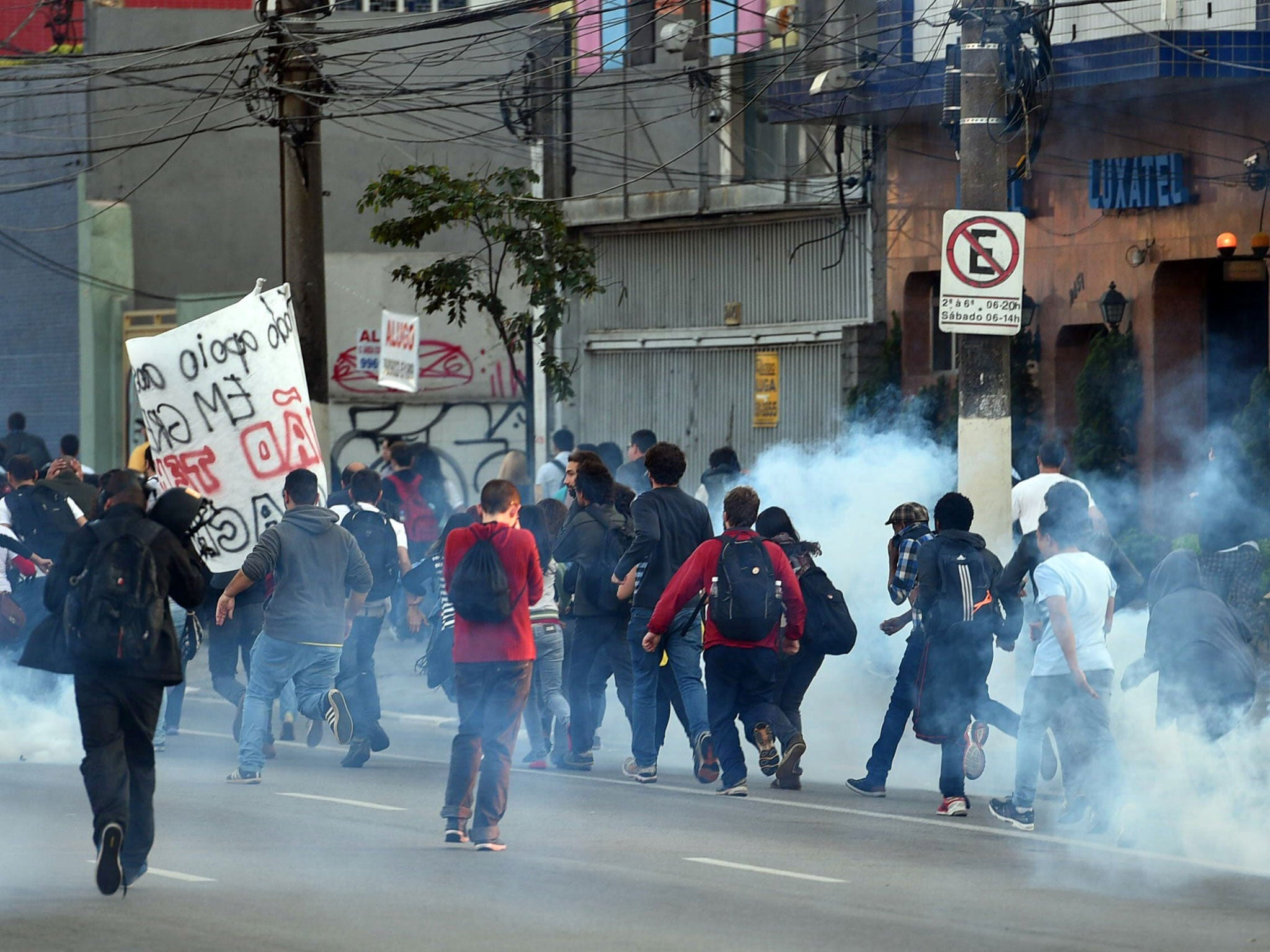 Striking subway workers and members of the MTST (Homeless Workers' Movement), are dispersed with tear gas by police forces as they demonstrate in Sao Paulo