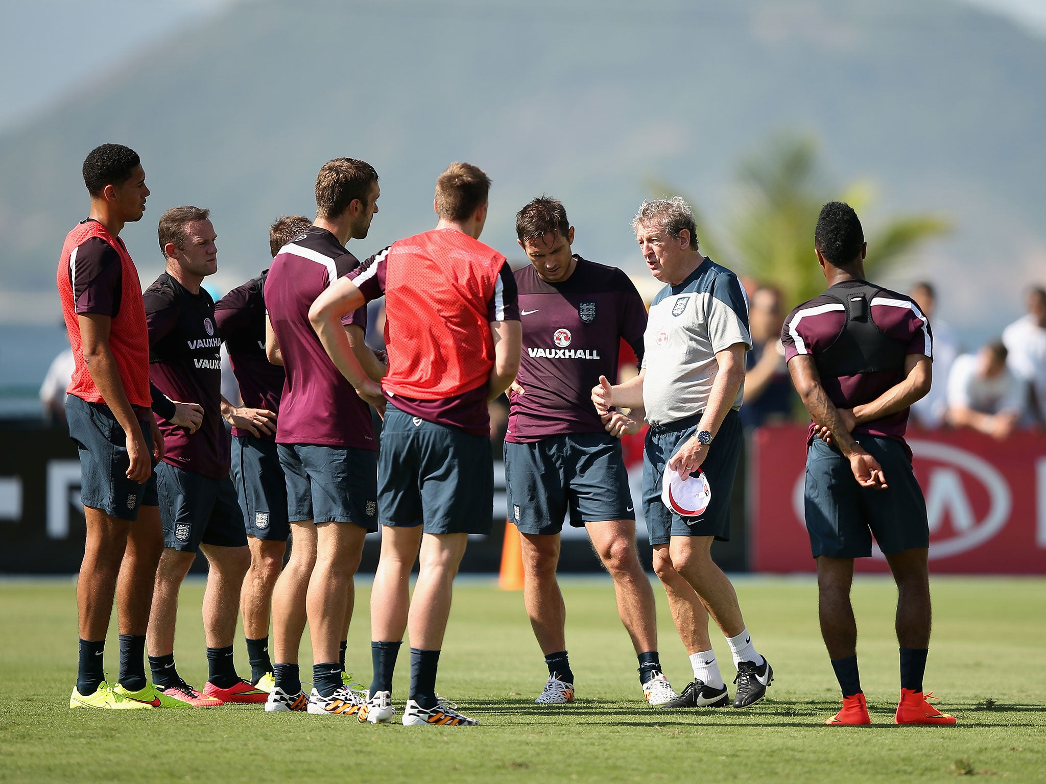Roy Hodgson gives instructions to players during a training session at the Urca military base in Rio de Janeiro, Brazil.