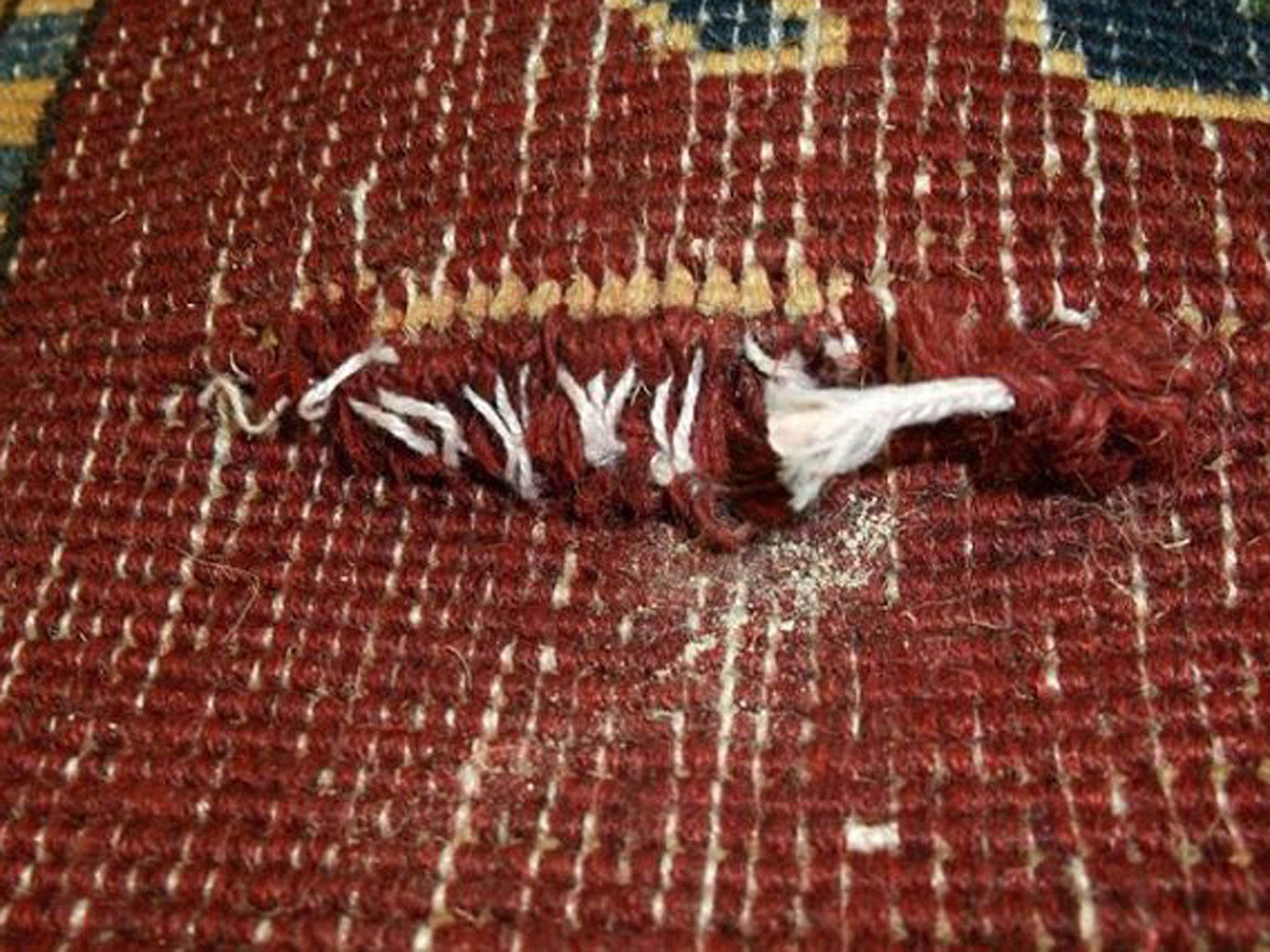 Packets of heroin woven into hand-made rugs from Pakistan